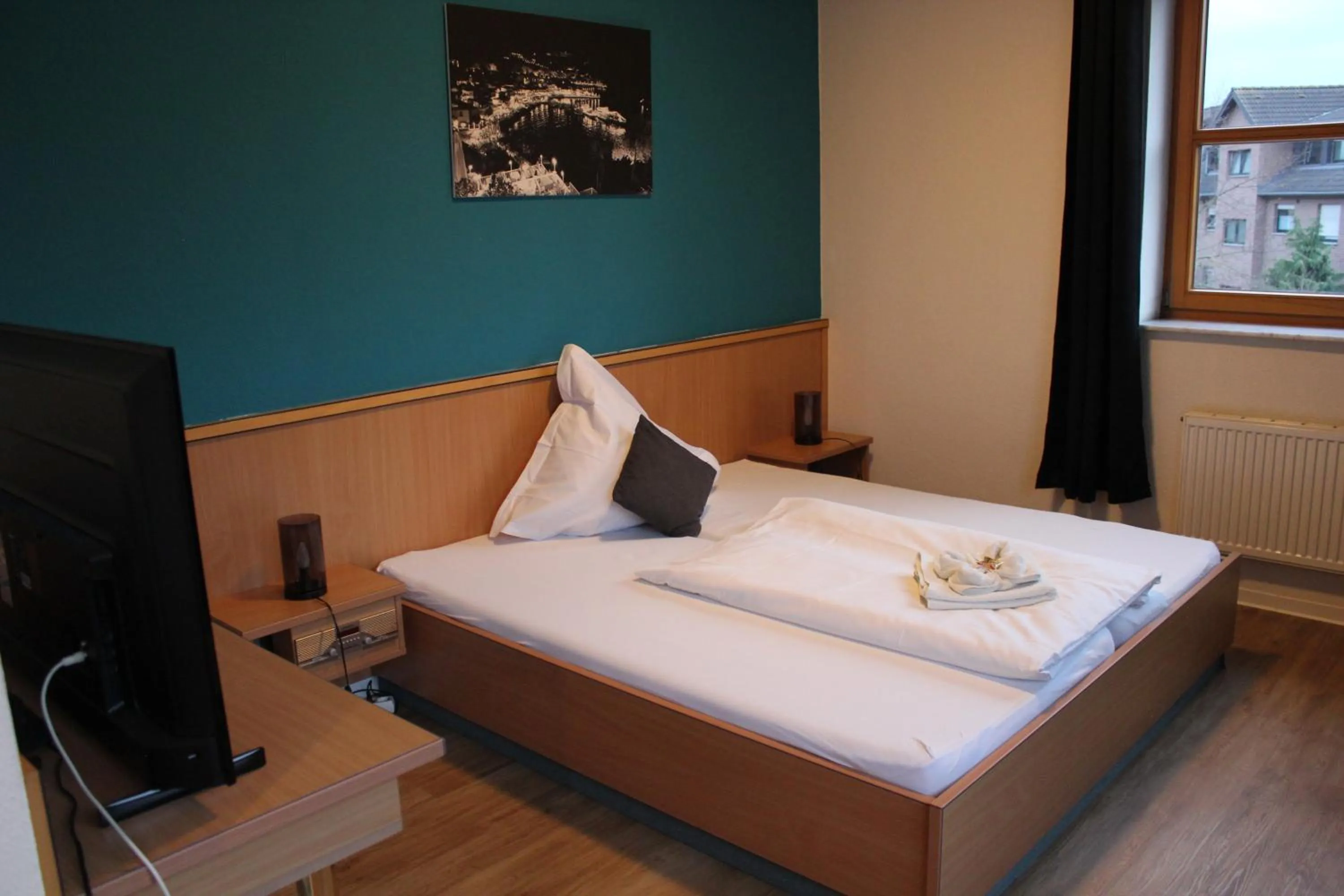 Bed in Olympia Hotel & Restaurant