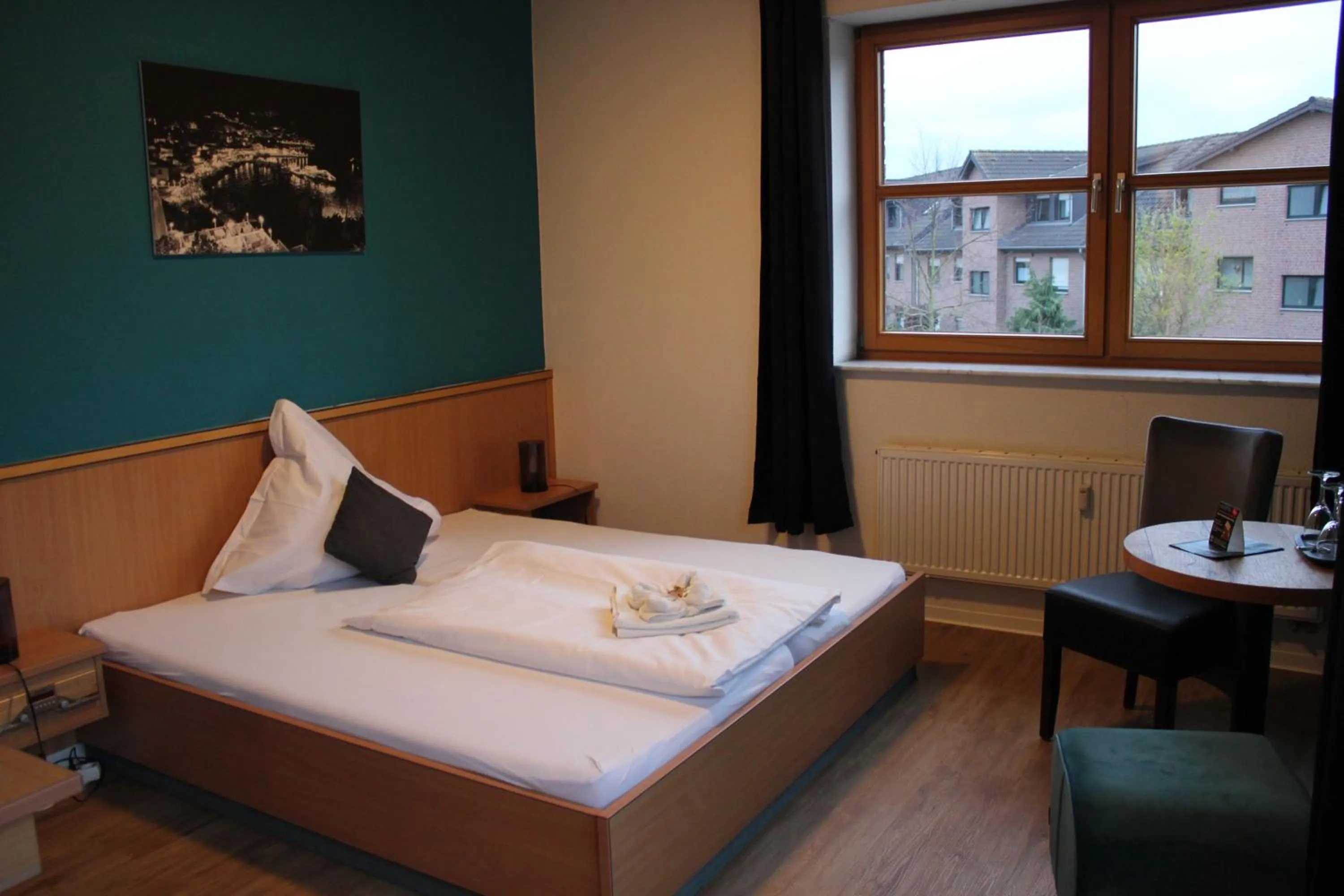 Bed in Olympia Hotel & Restaurant