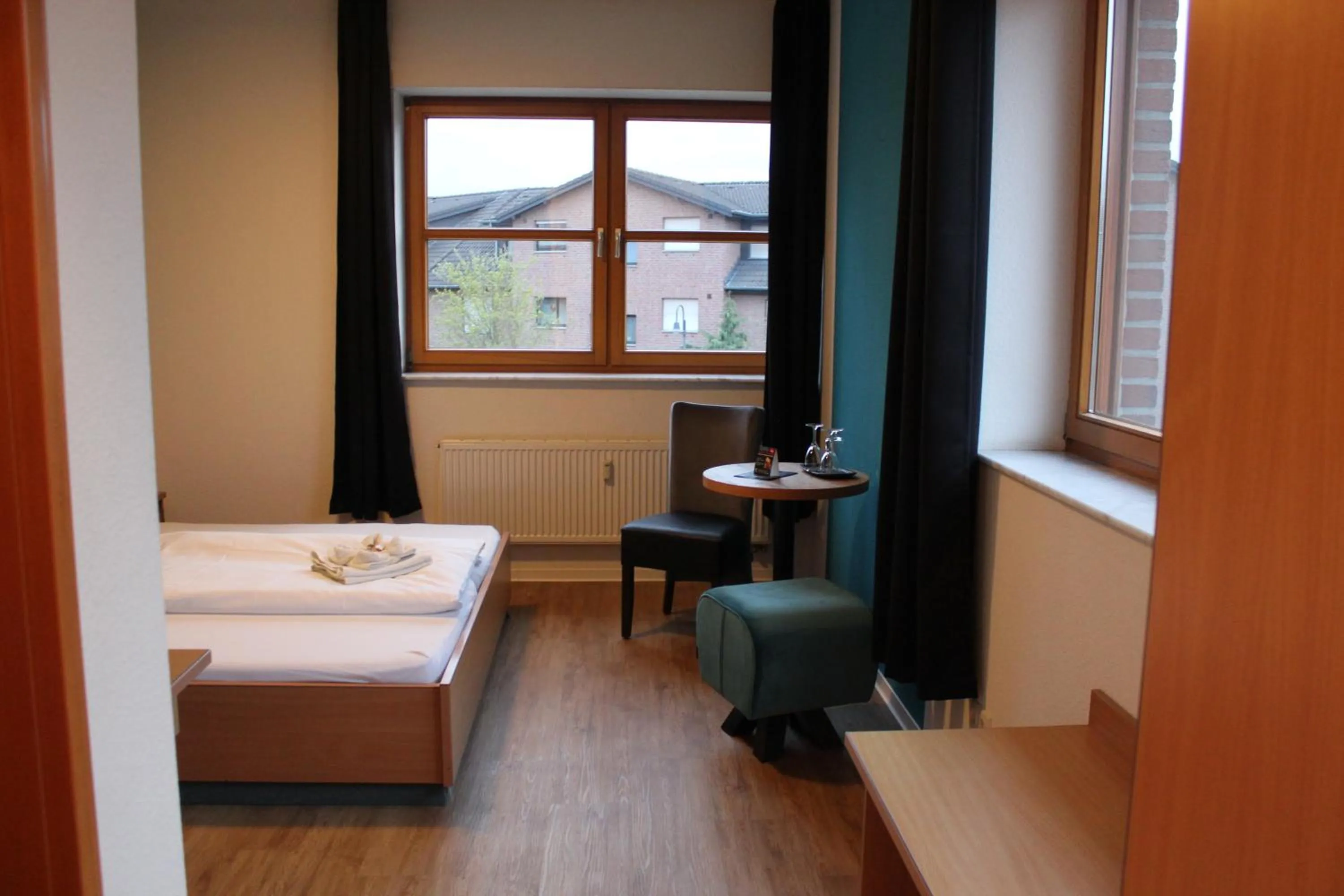 Photo of the whole room, Bed in Olympia Hotel & Restaurant