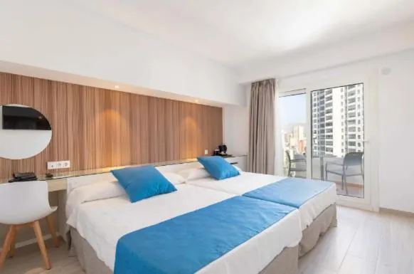 Bed in Hotel Rosamar