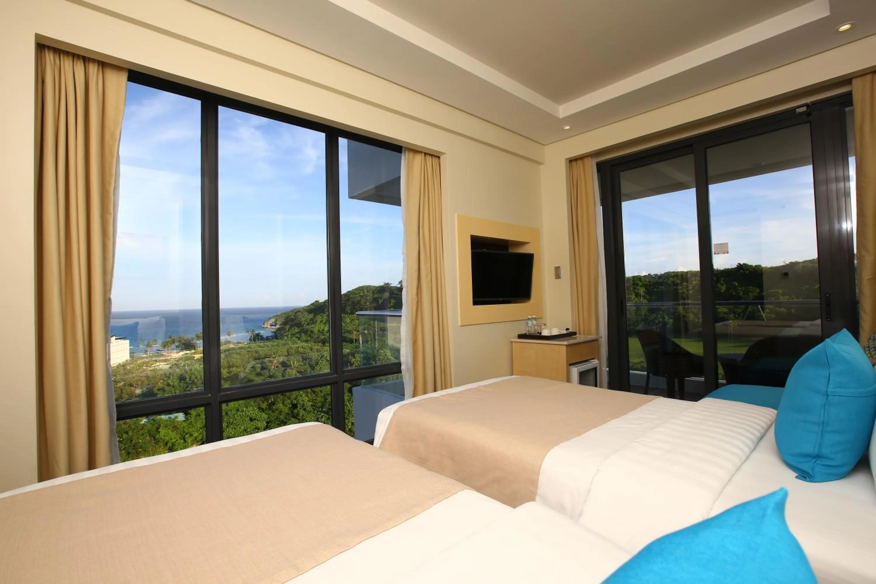 Photo of the whole room, Bed in Savoy Hotel Boracay near Newcoast Beach