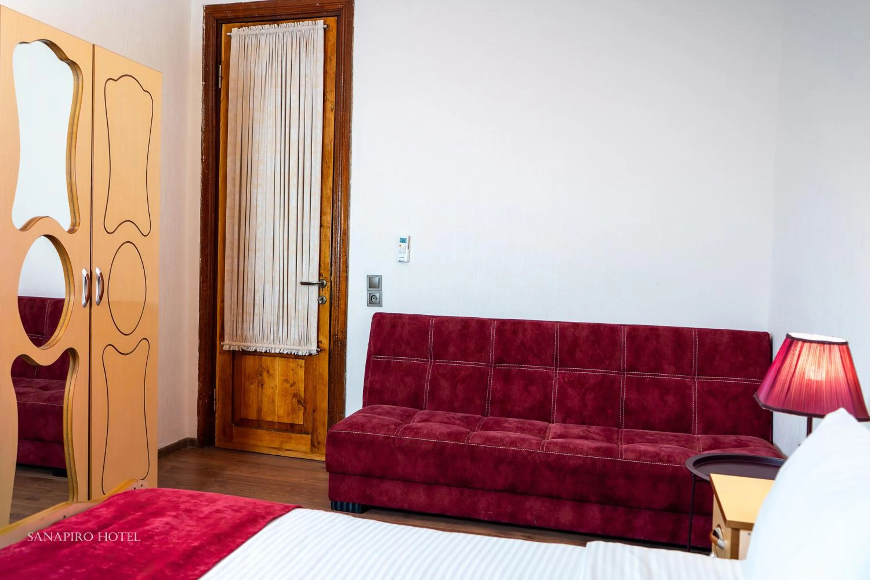 Bed in Sanapiro Hotel