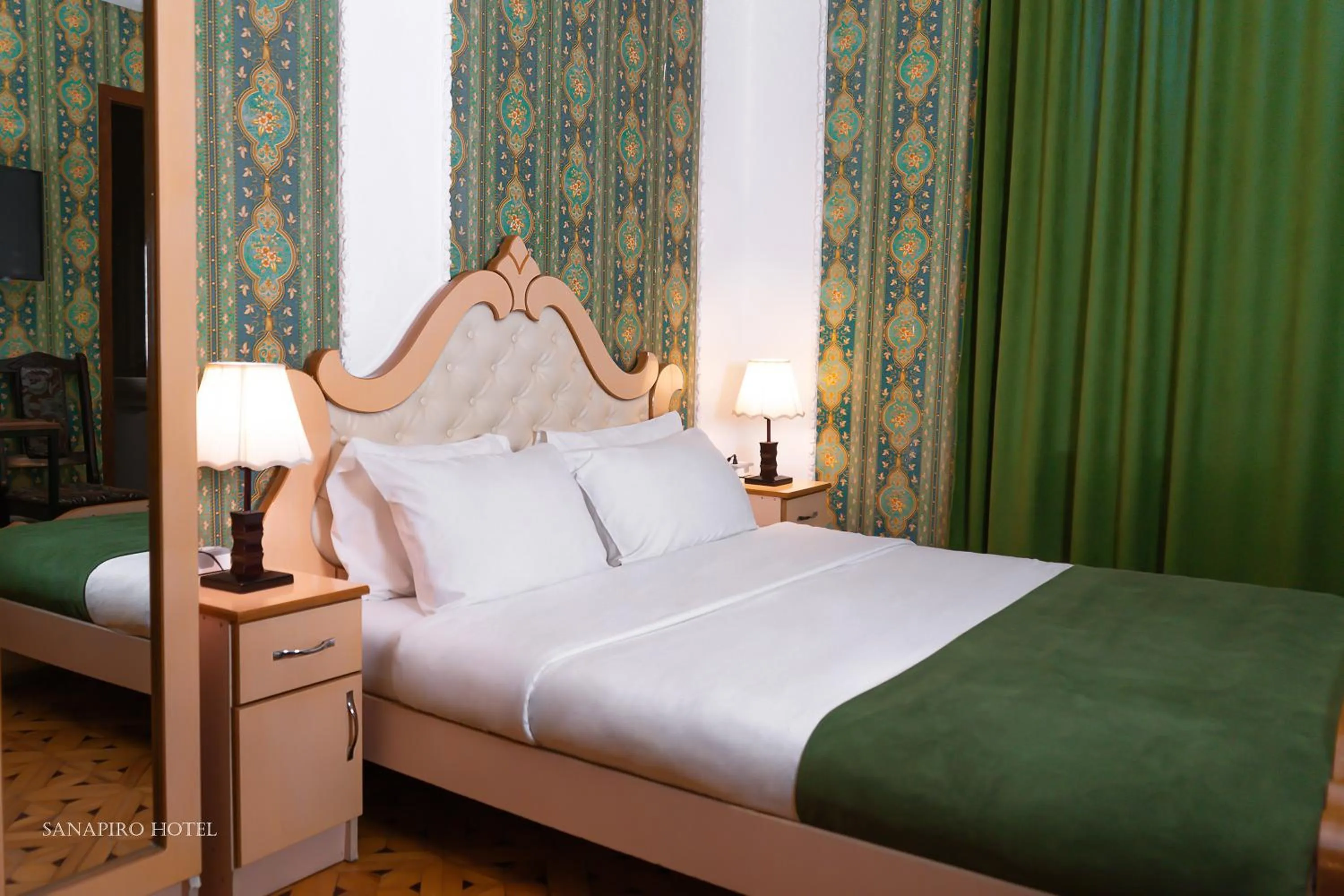 Bed in Sanapiro Hotel