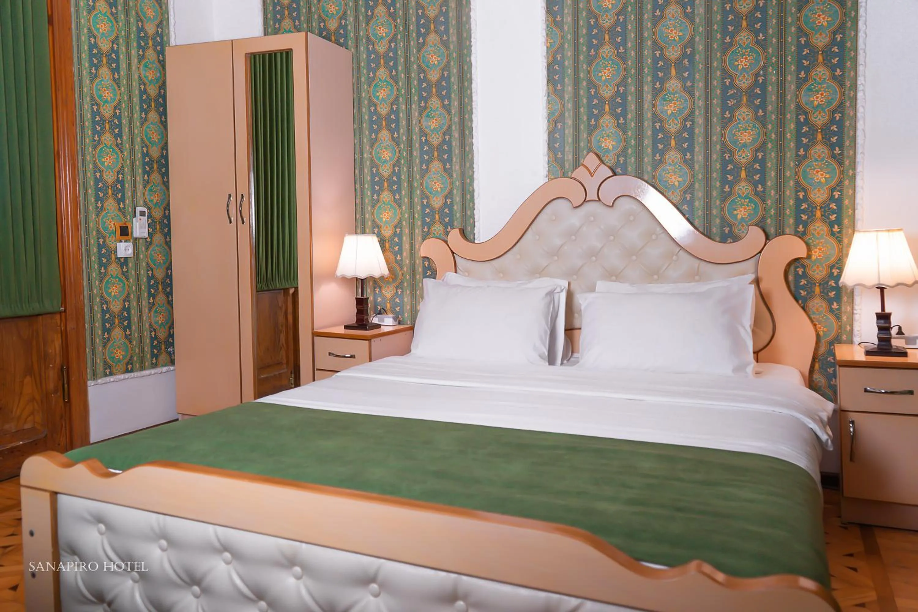 Bed in Sanapiro Hotel