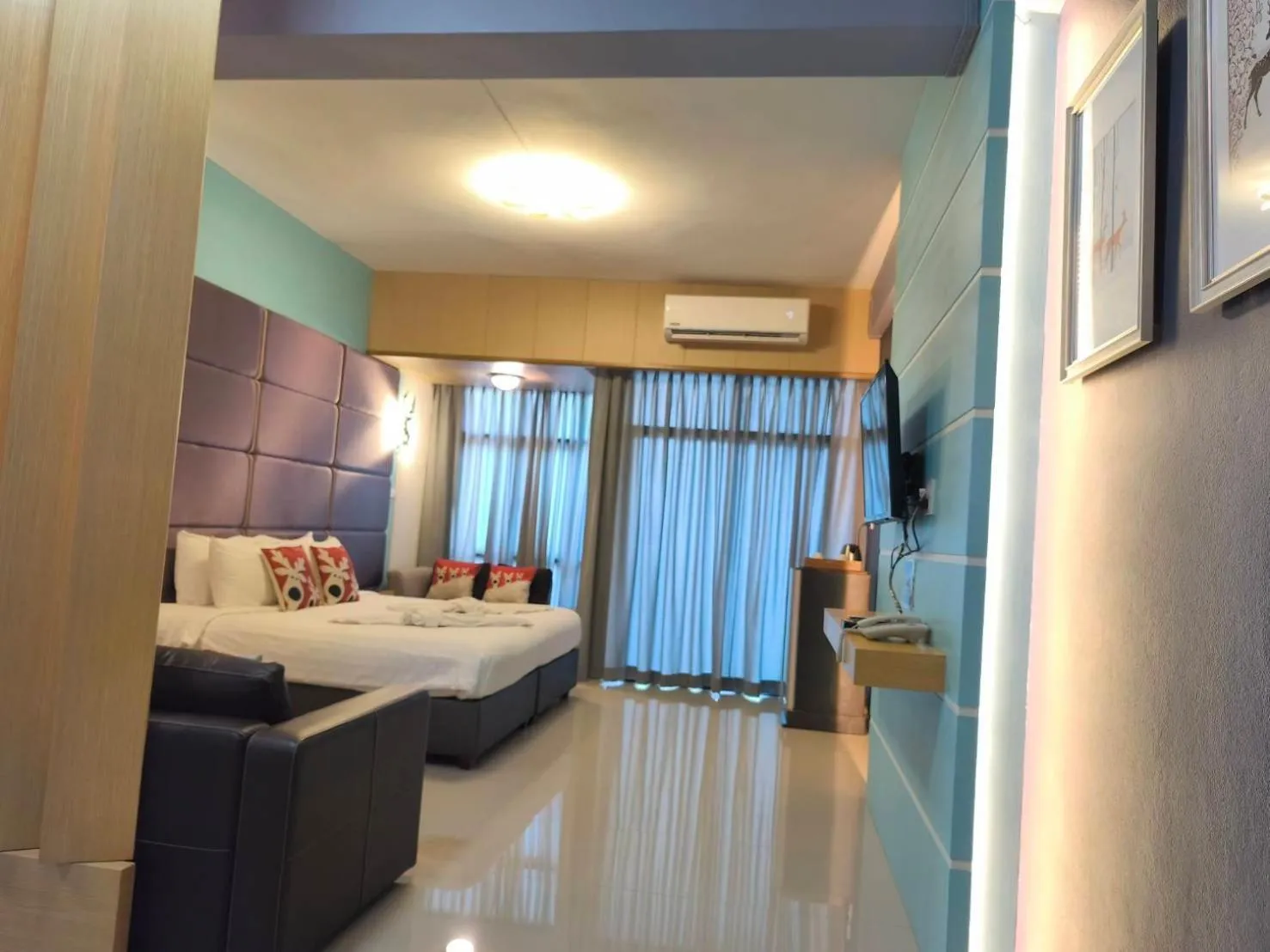 Bed in The Iconic Hotel Ranong