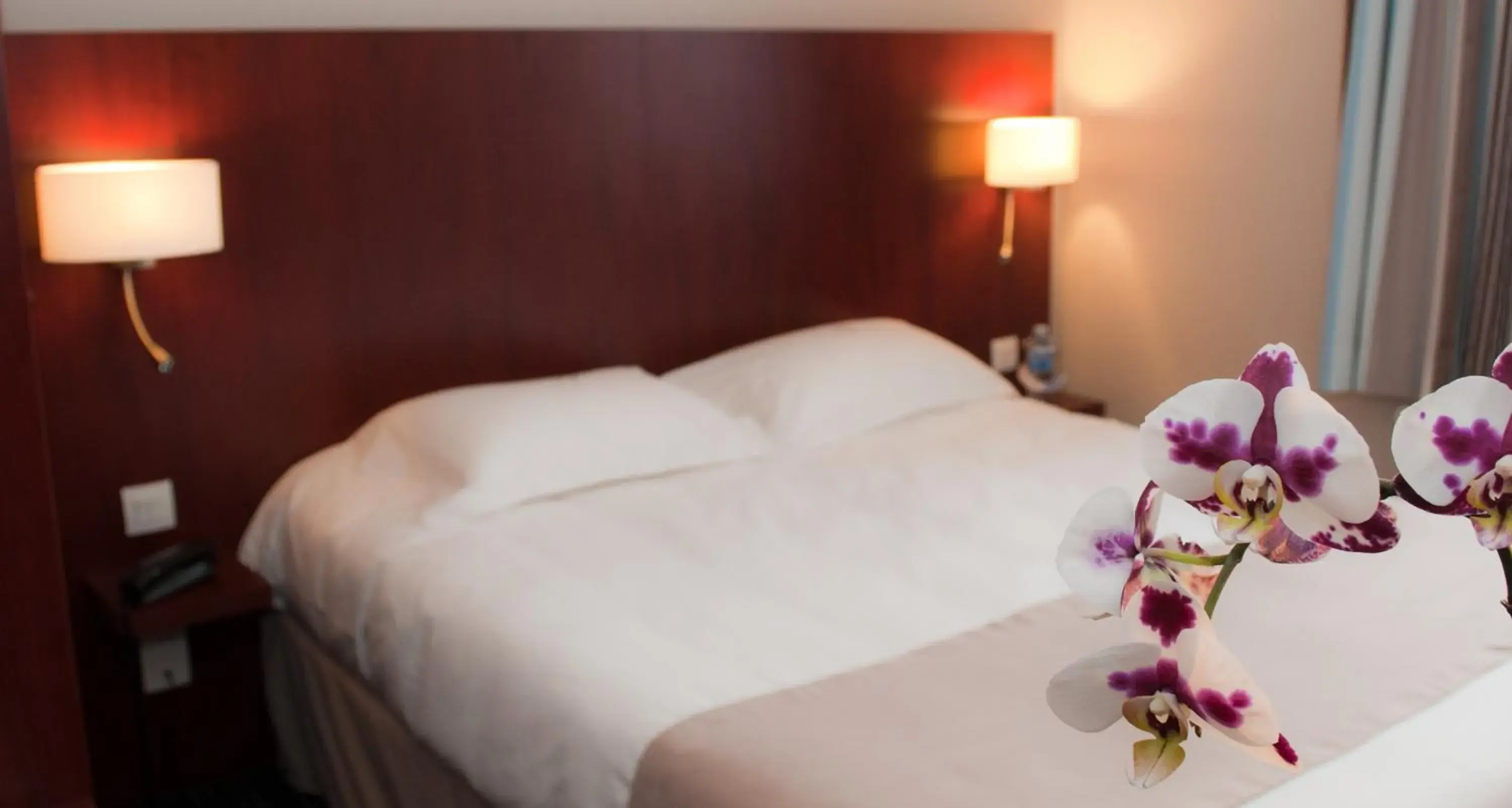 Bed in Kyriad Saint-Malo Dinard Bed in Kyriad Saint-Malo Dinard