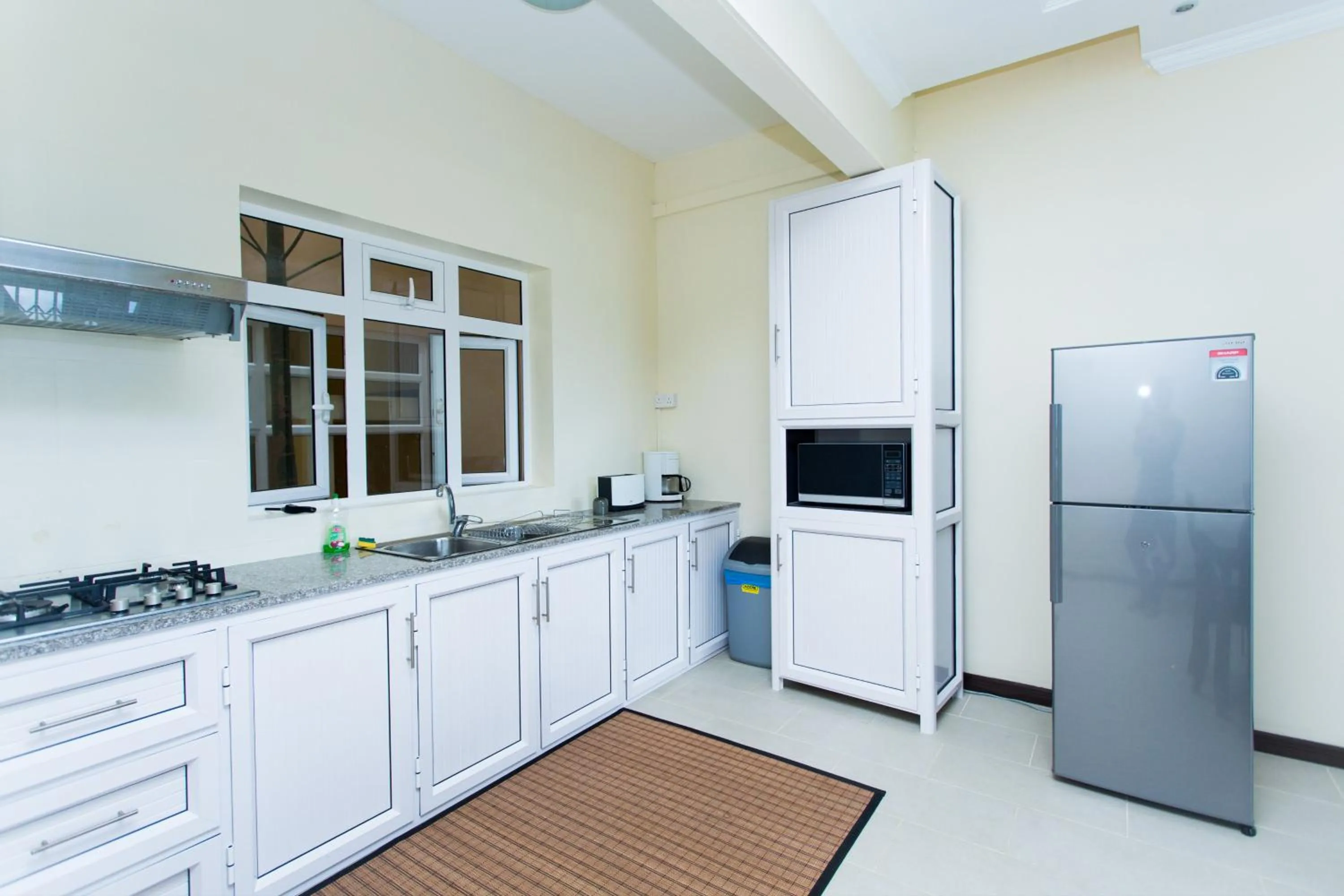 Kitchen or kitchenette in Garden Villas