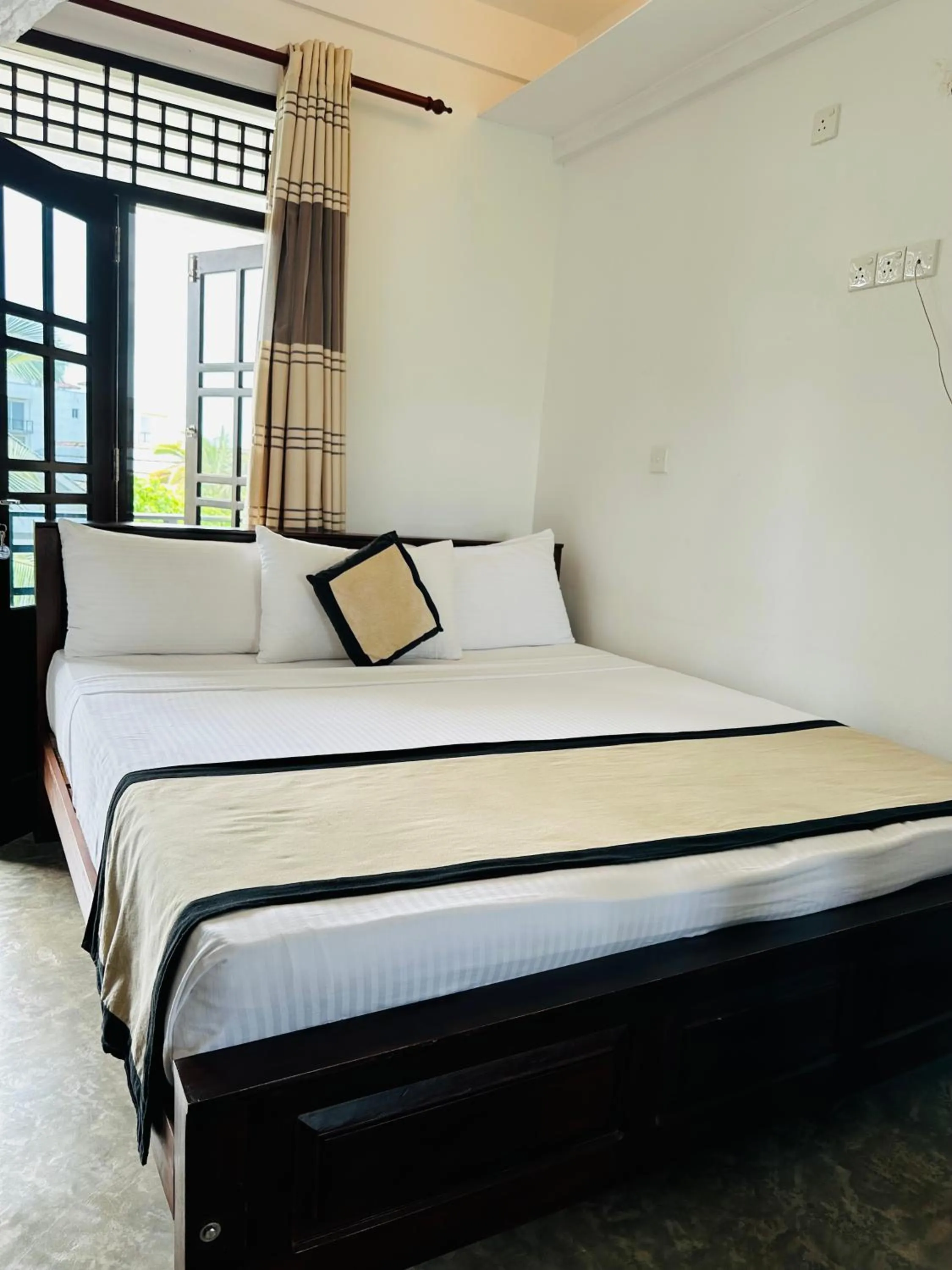 Bed in Mirissa Gate Resort