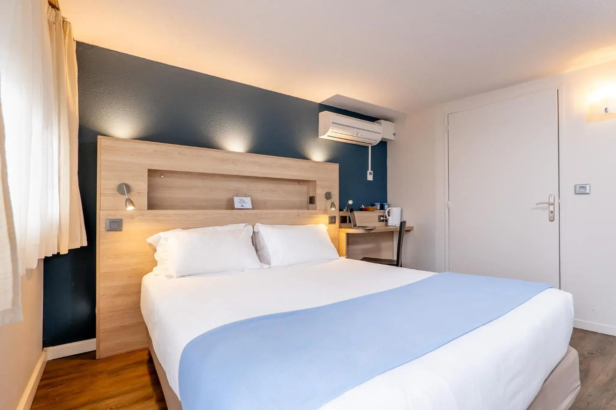 Bed in Kyriad Digne-Les-Bains Bed in Kyriad Digne-Les-Bains