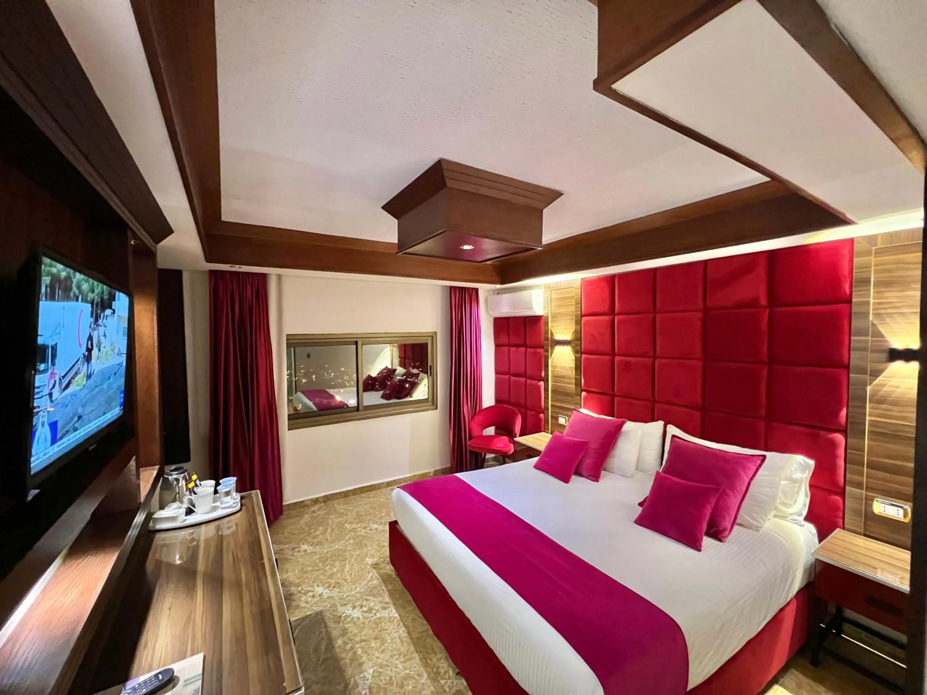 Communal lounge/ TV room, Bed in Petra Sella Hotel