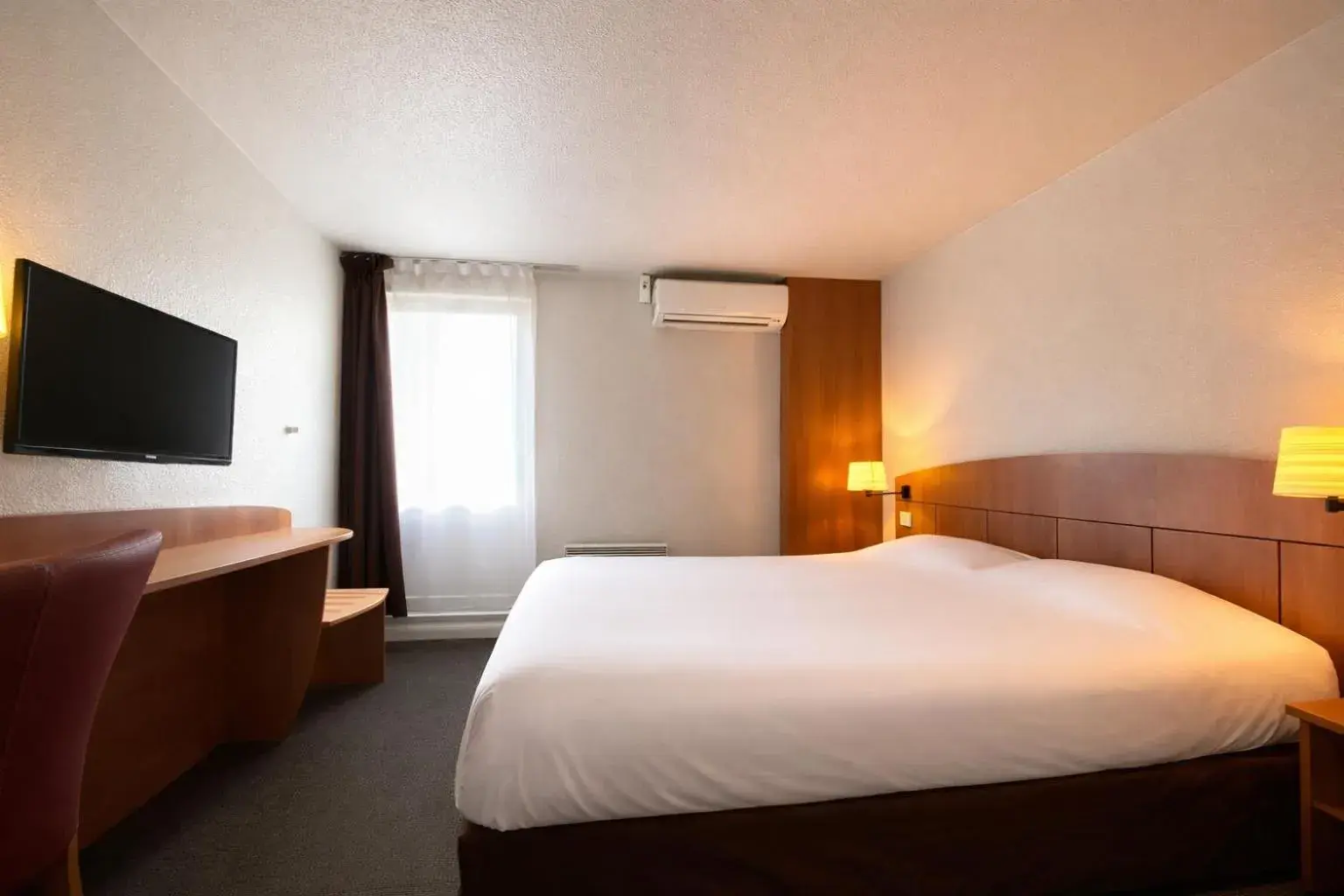 Photo of the whole room, Bed in Kyriad Montargis Amilly Photo of the whole room, Bed in Kyriad Montargis Amilly