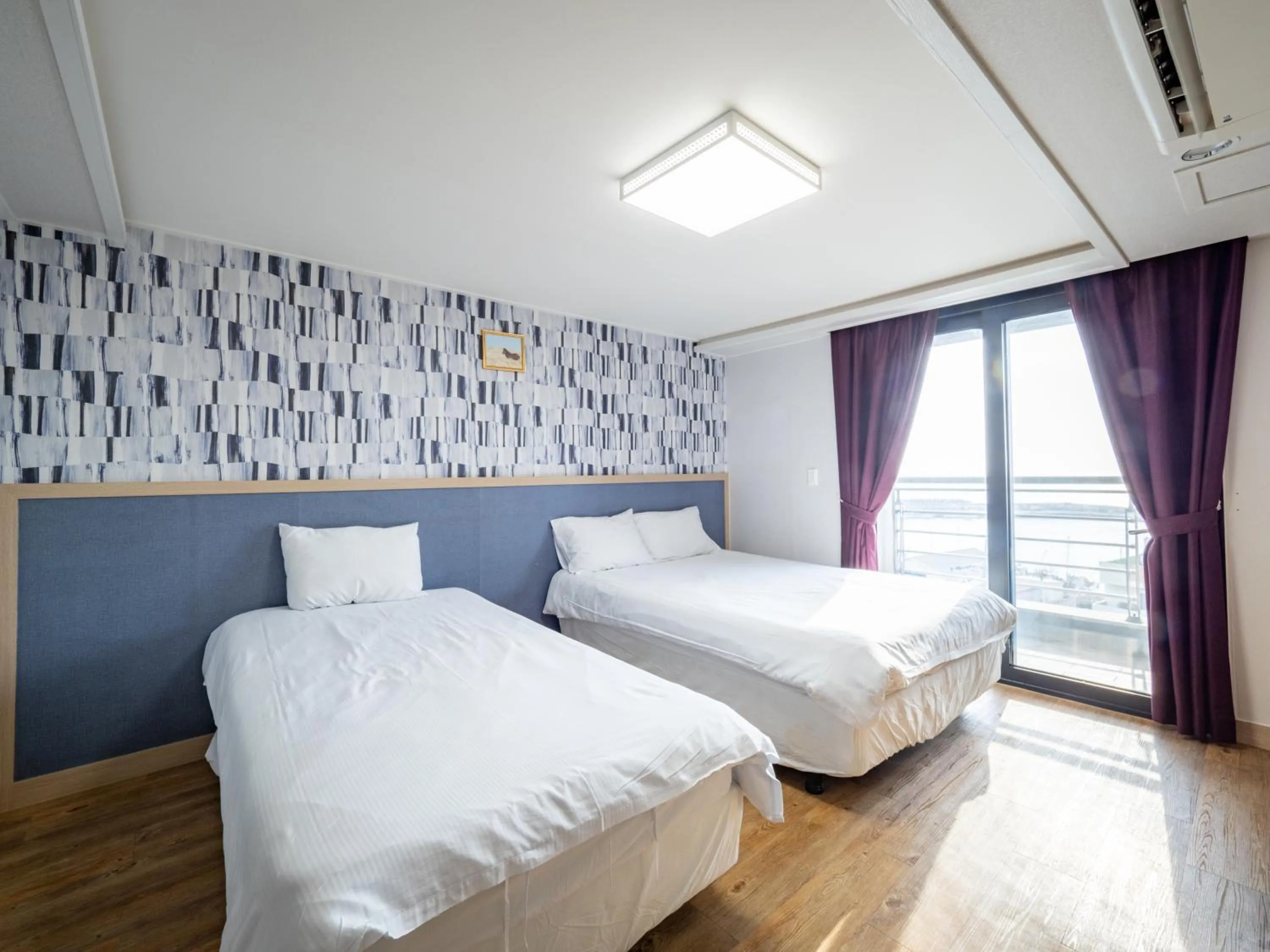 Bed in Jeju Moseulpo Hotel