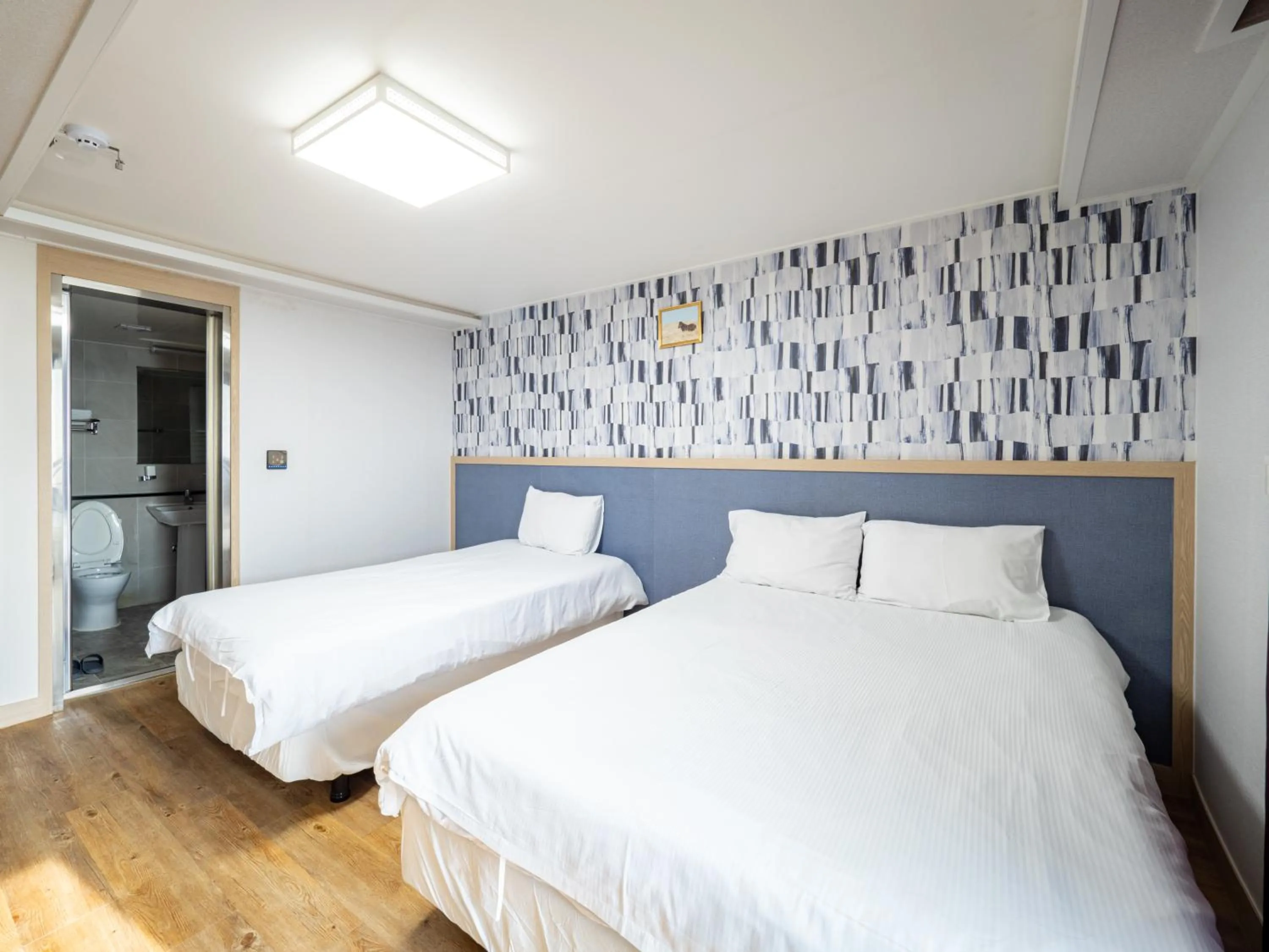 Bed in Jeju Moseulpo Hotel