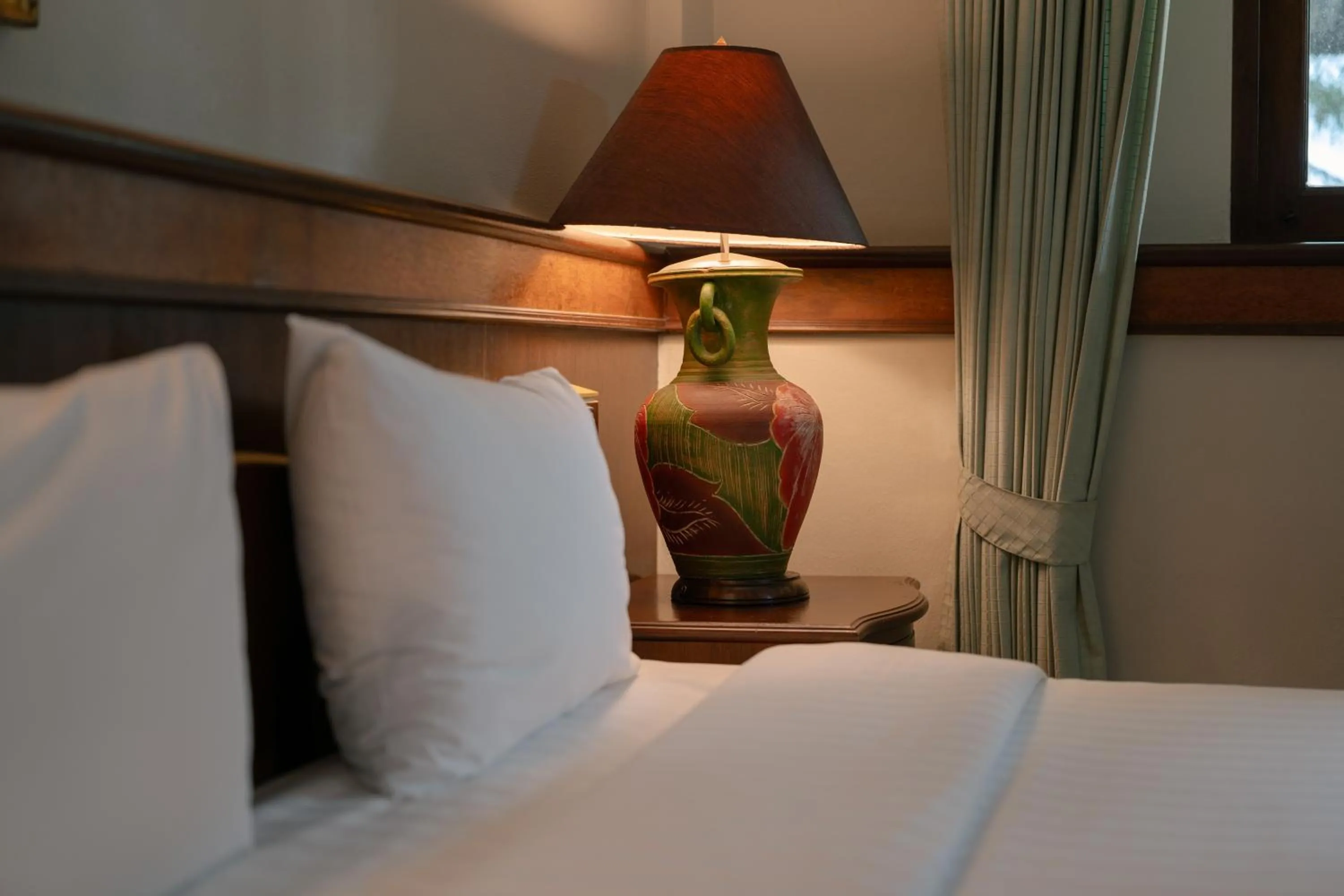 Text overlay, Bed in Erawan Phangnga Hotel, Natai Beach