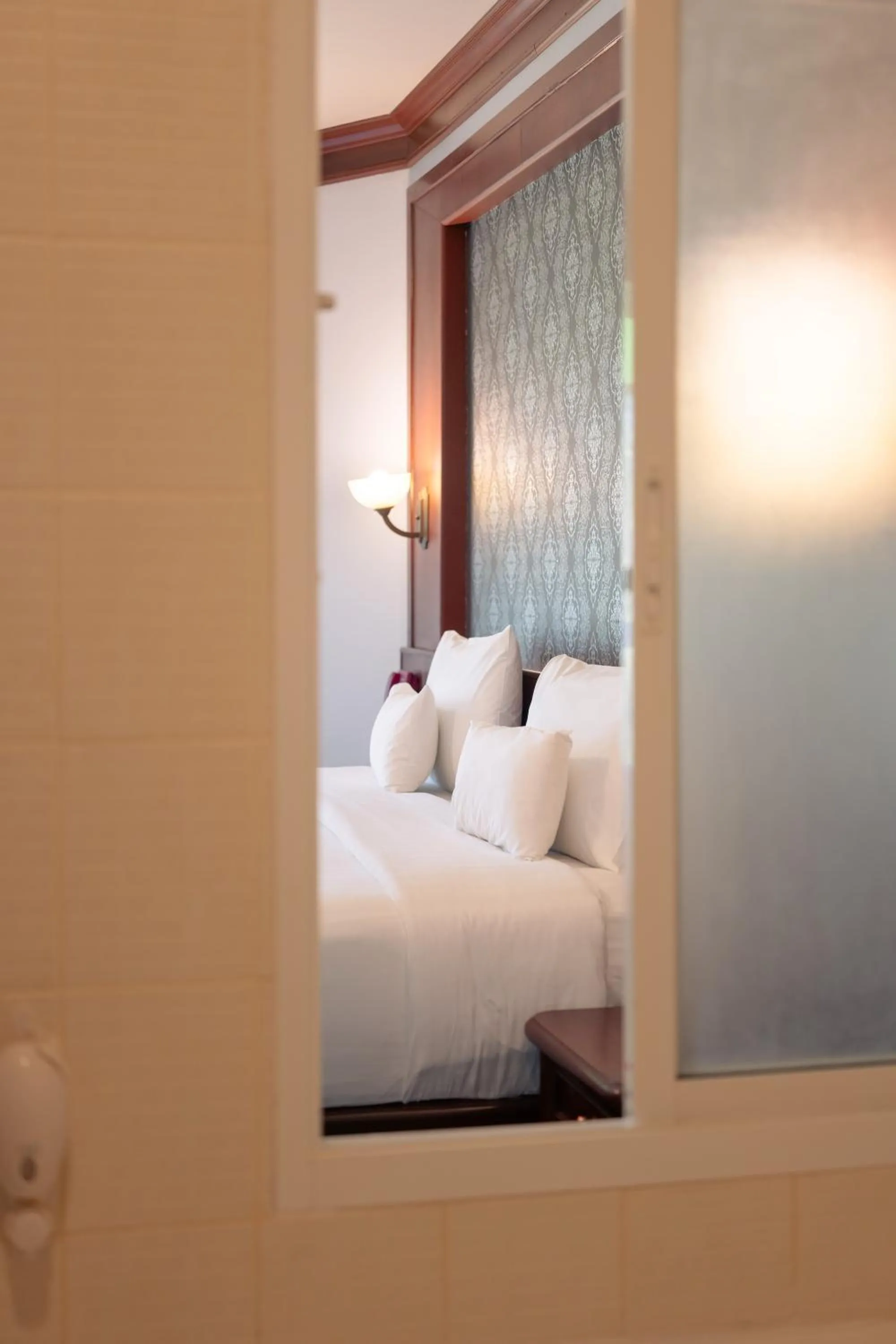 Text overlay, Bed in Erawan Phangnga Hotel, Natai Beach