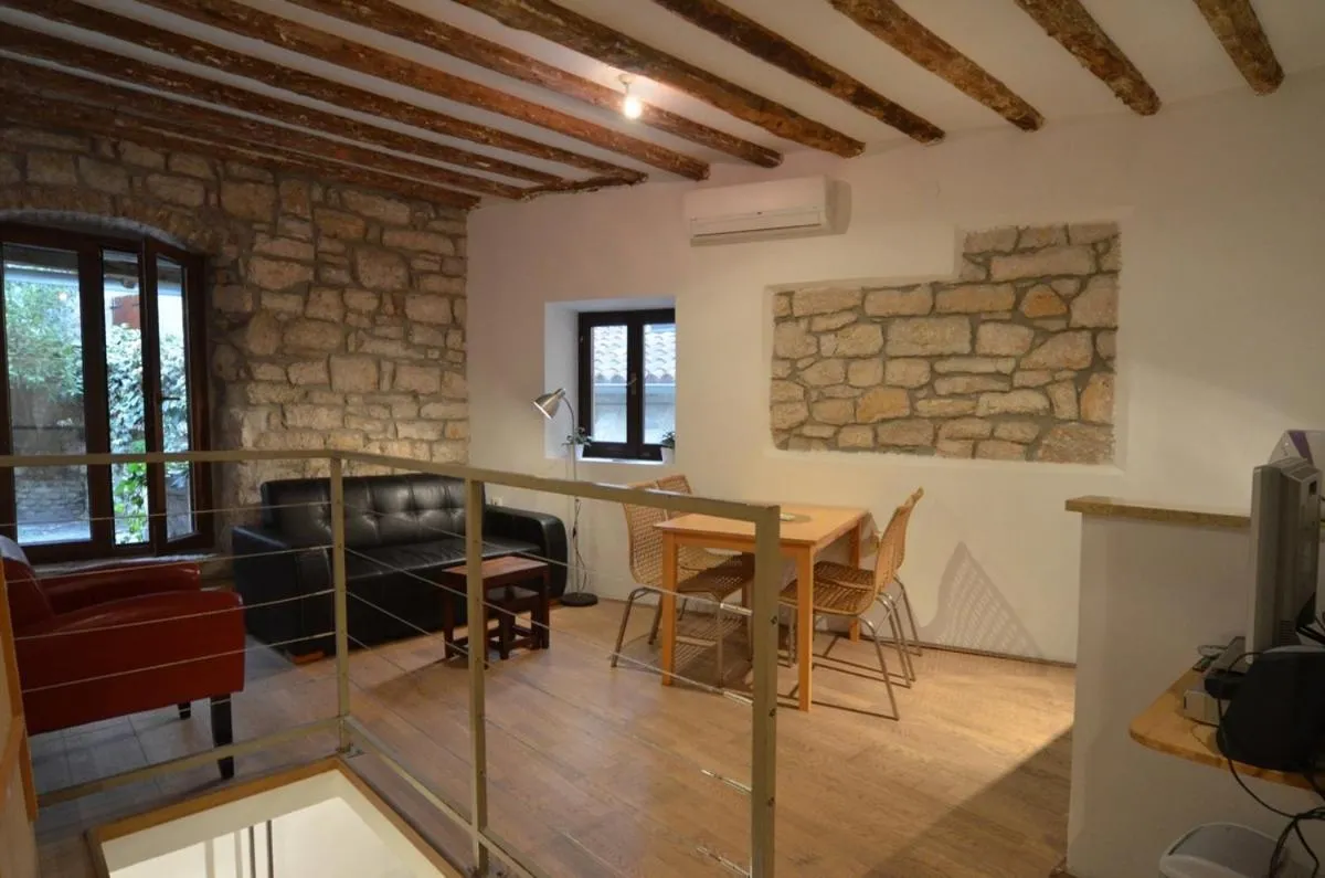 Seating area in Apartment Il Cortile with garden and parking