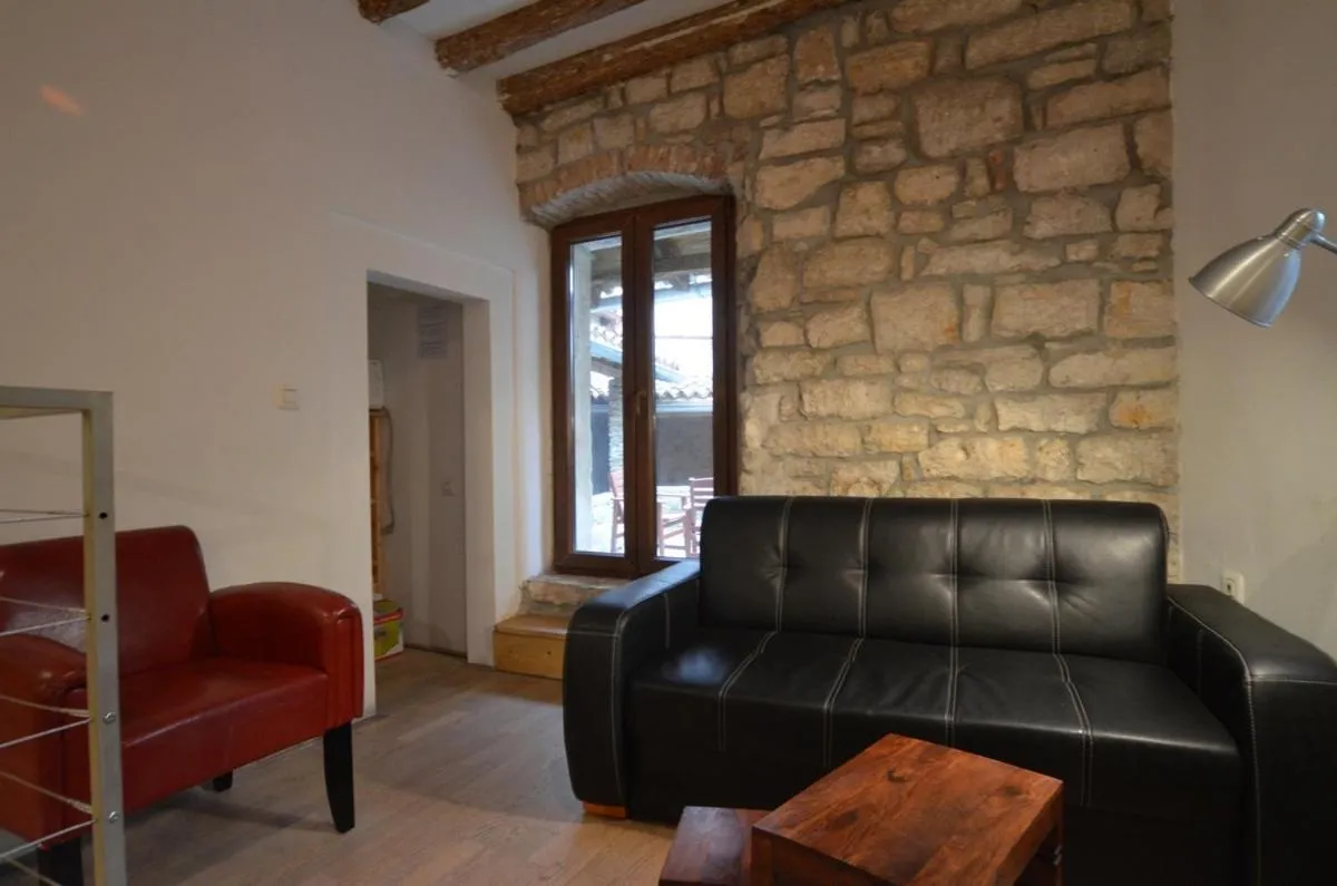 Seating area in Apartment Il Cortile with garden and parking