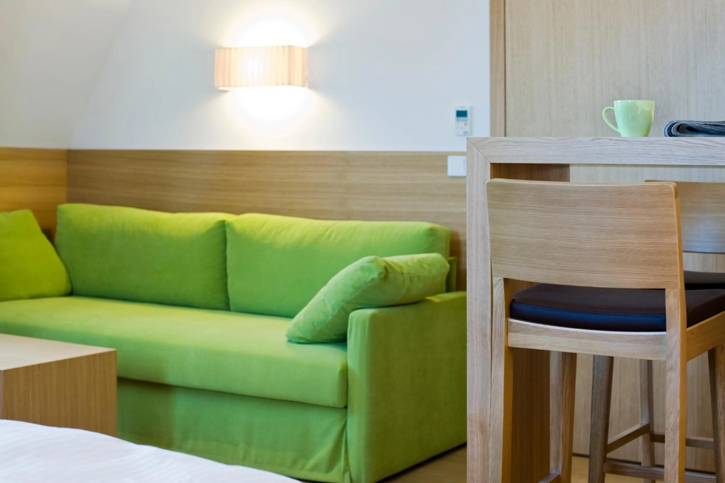 Seating area, Bed in Hotel Thalmair