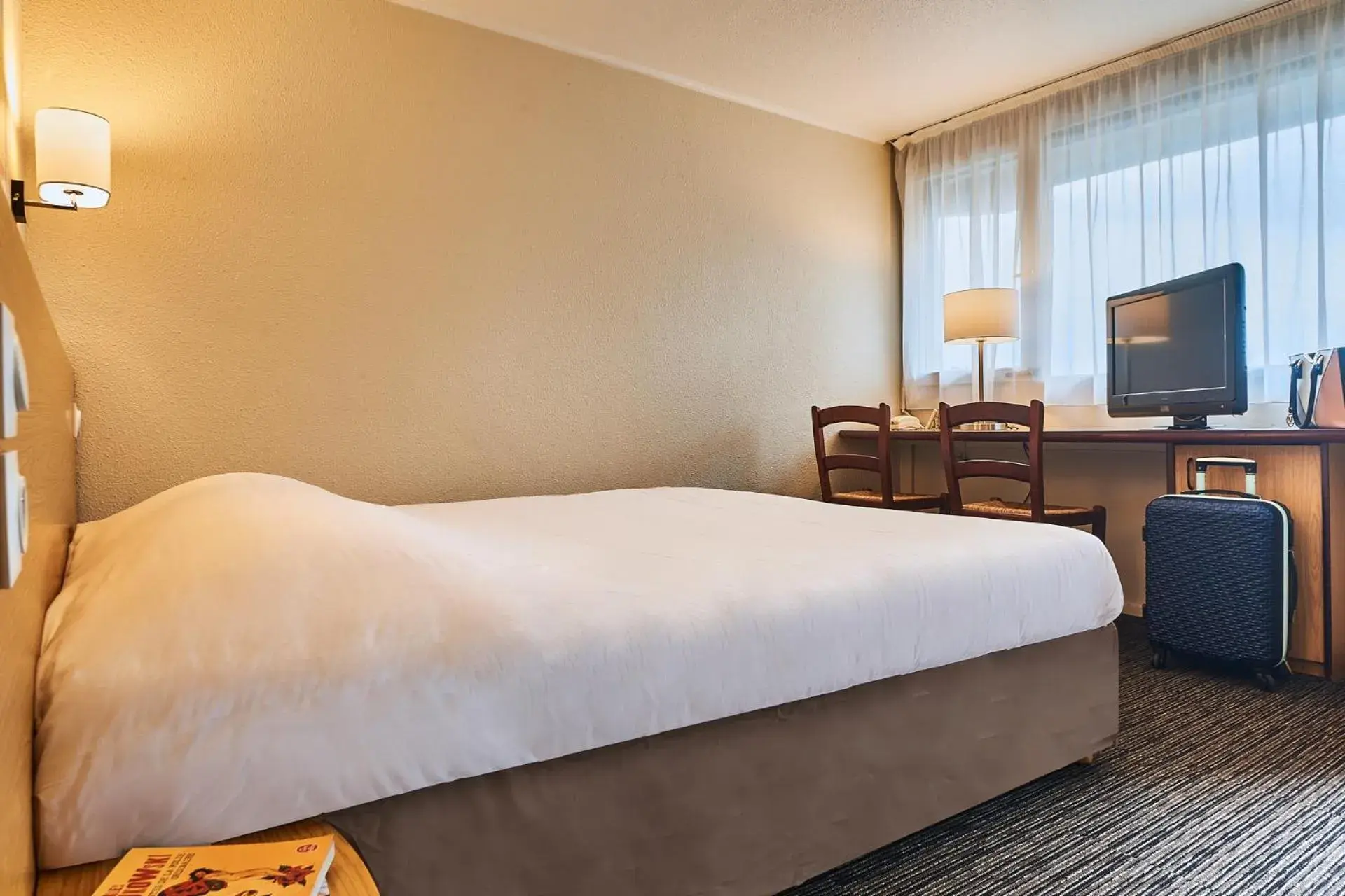 Bed in Kyriad Direct Haguenau Bed in Kyriad Direct Haguenau