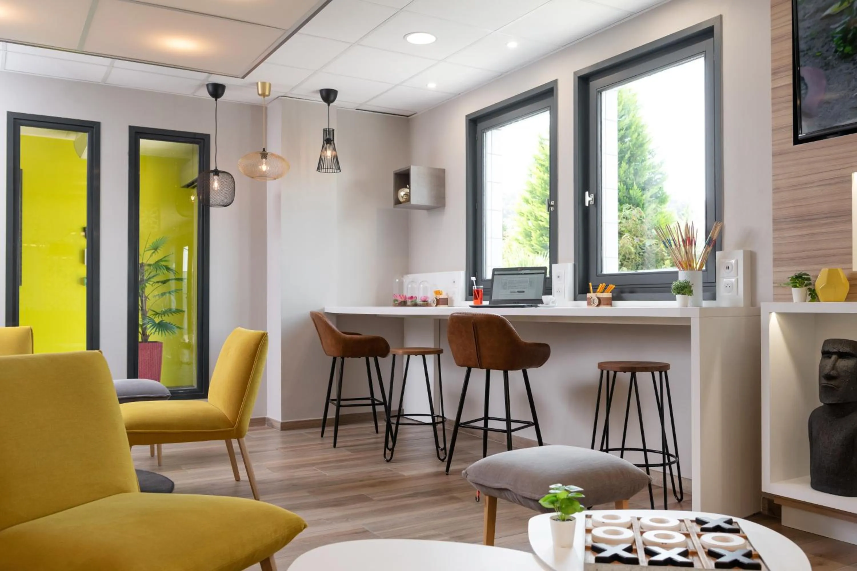 Communal lounge/ TV room in Kyriad Saint-Etienne Centre