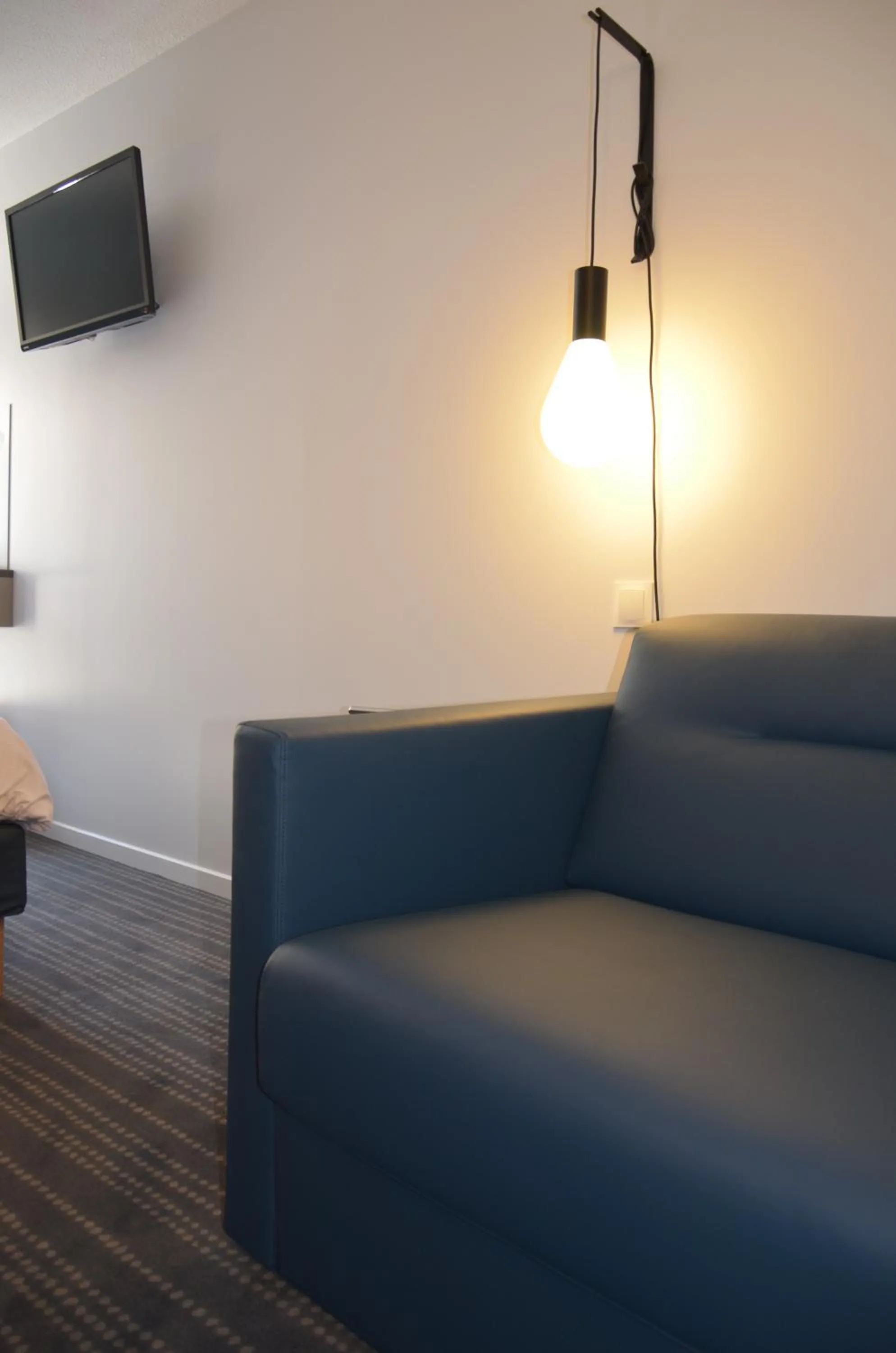 Bedroom in Kyriad Metz Centre - Restaurant Moze