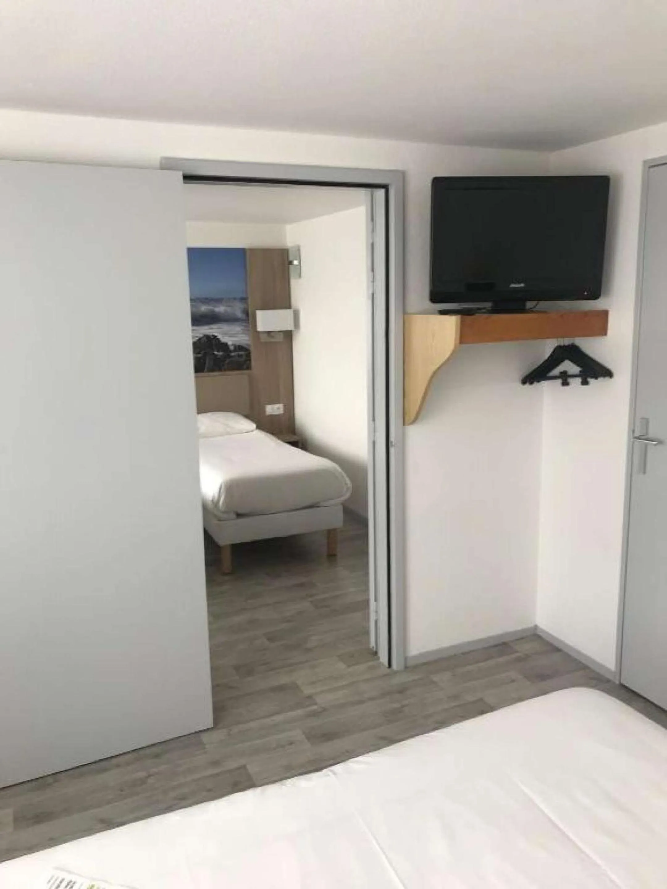 Bedroom, Bed in BRIT HOTEL Confort MORLAIX