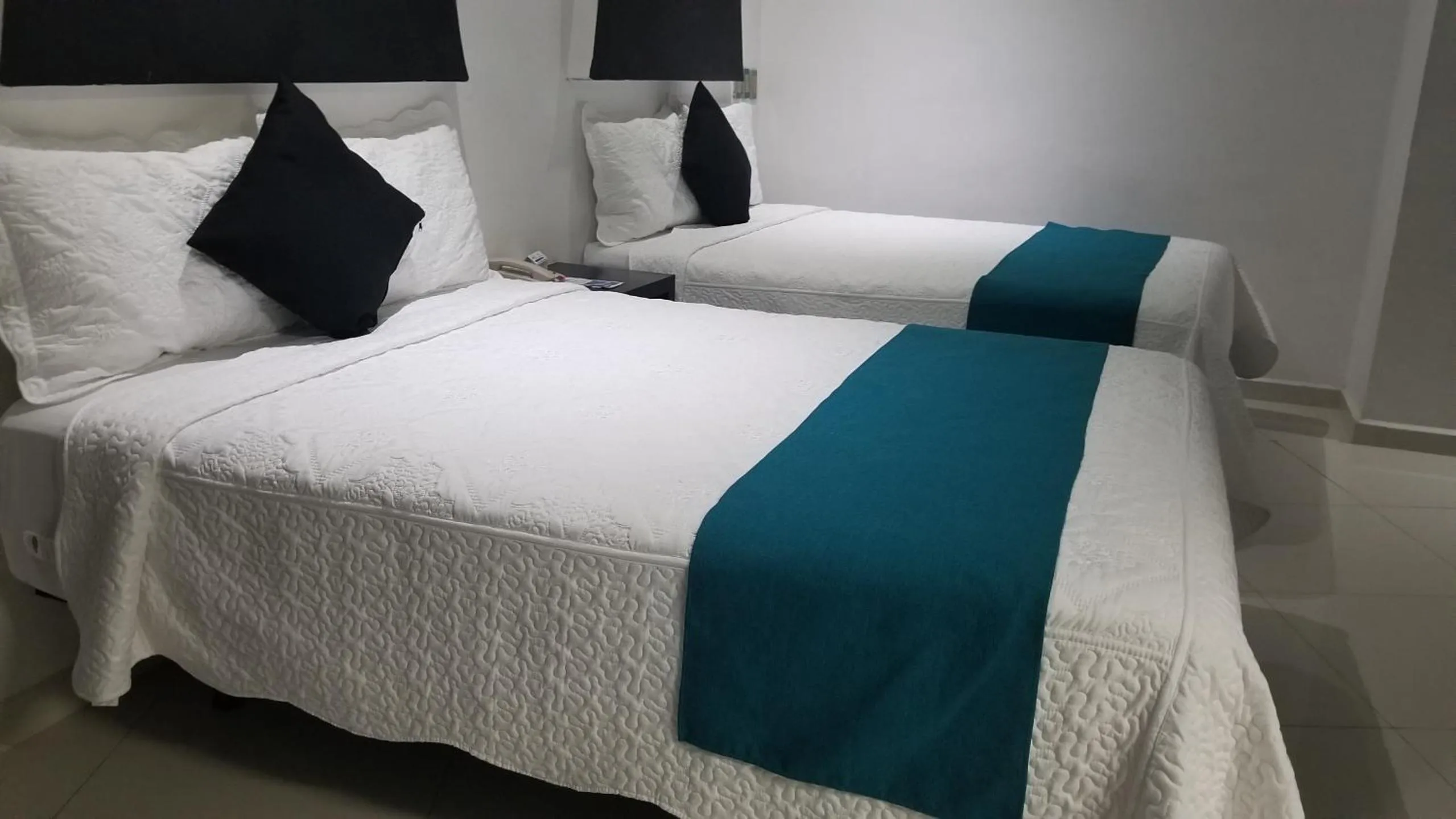 Bed in Hotel Dluxe
