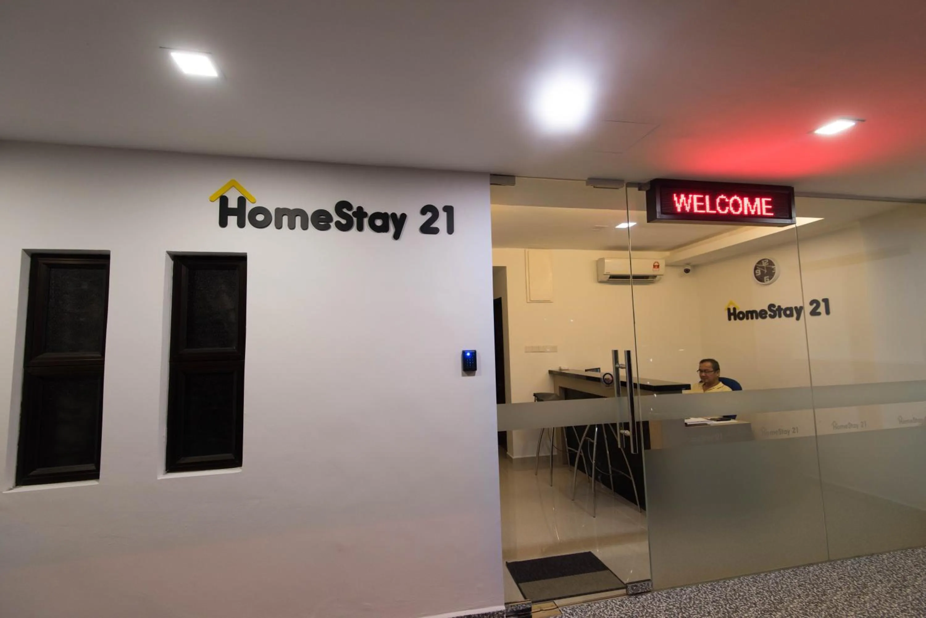 Property logo or sign in HomeStay 21 Hotel