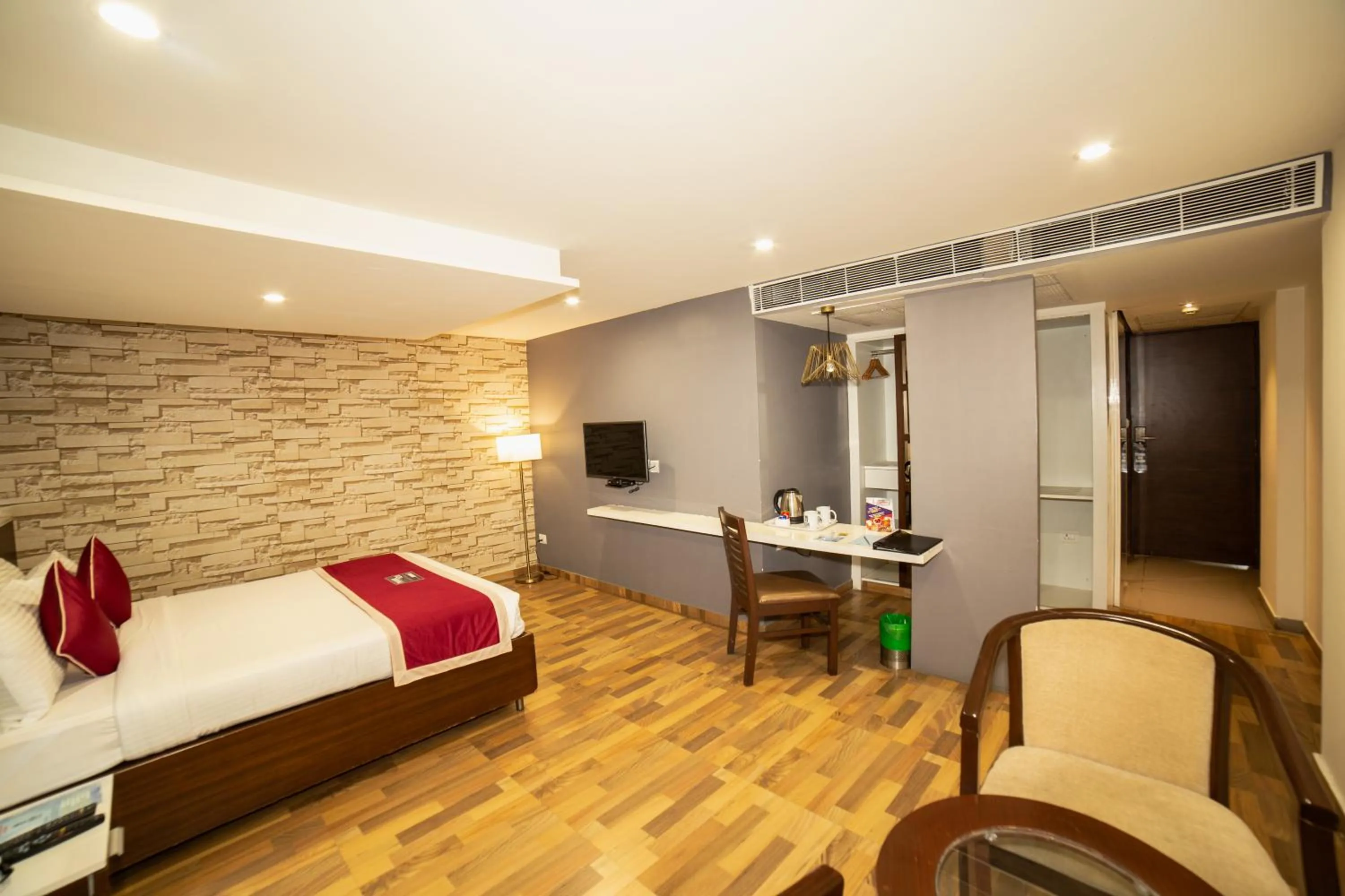 Bed in Icon Business Hotel by Bhagini