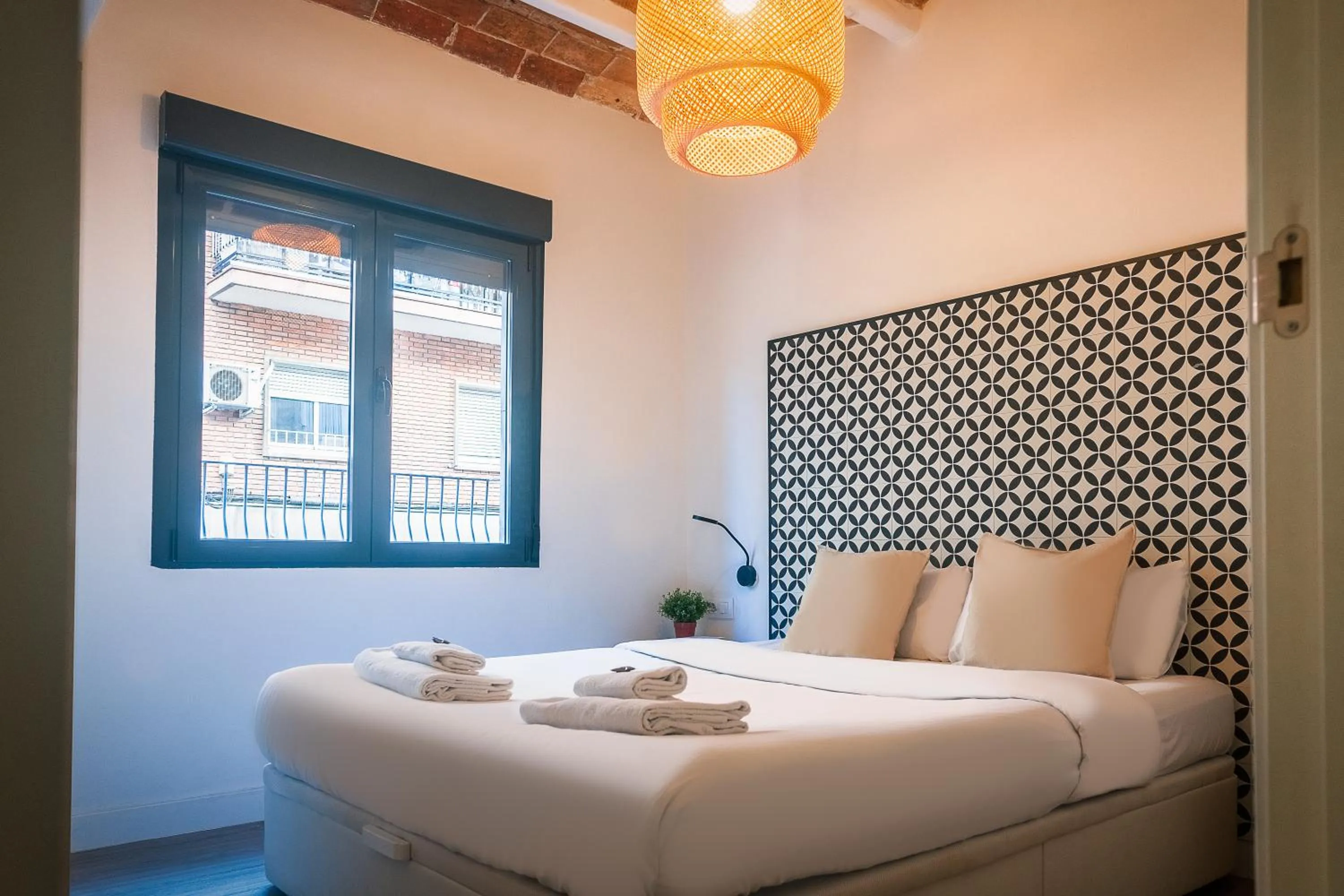 Bed in Modern Catalan Apartments by Olala Homes