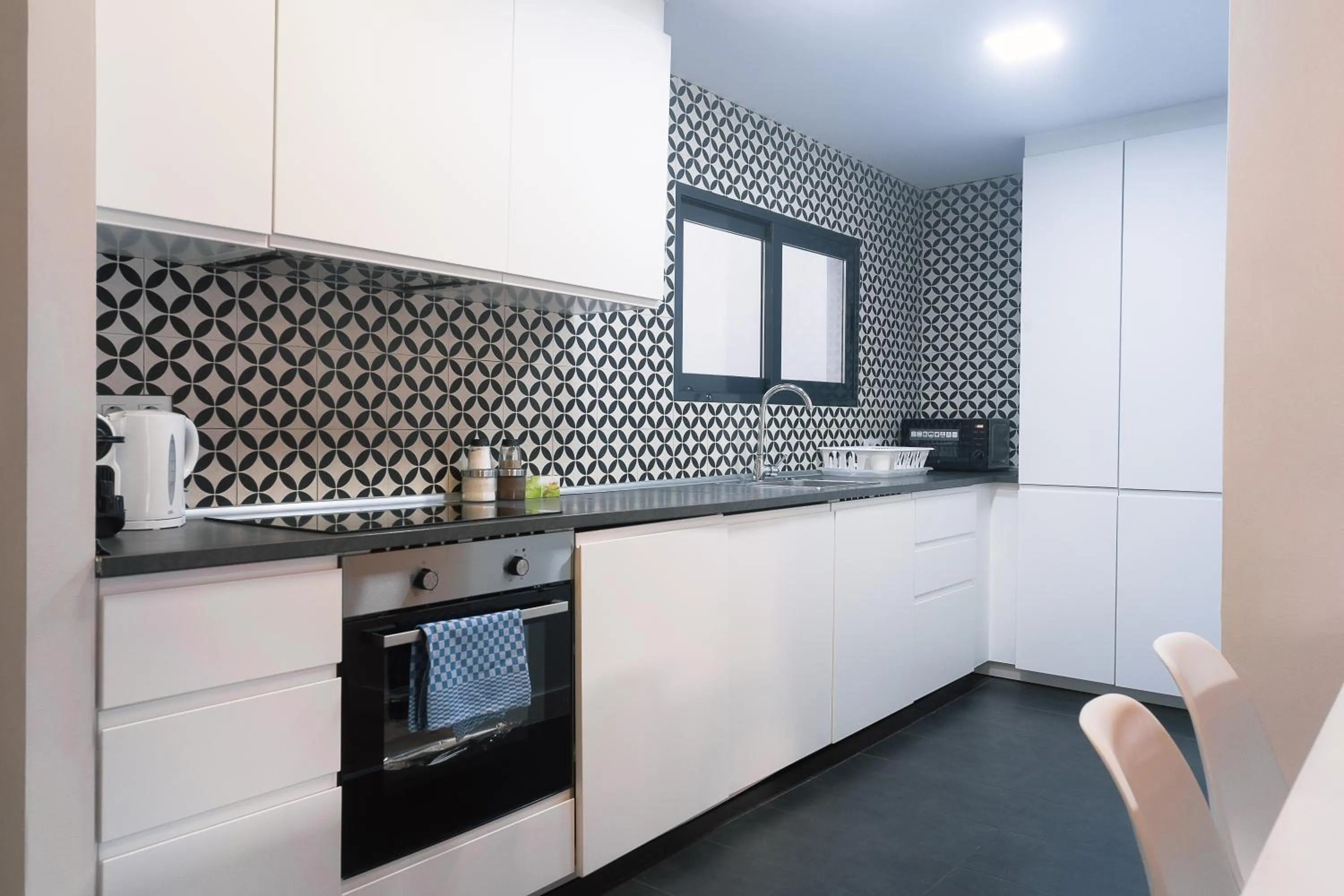 kitchen in Modern Catalan Apartments by Olala Homes