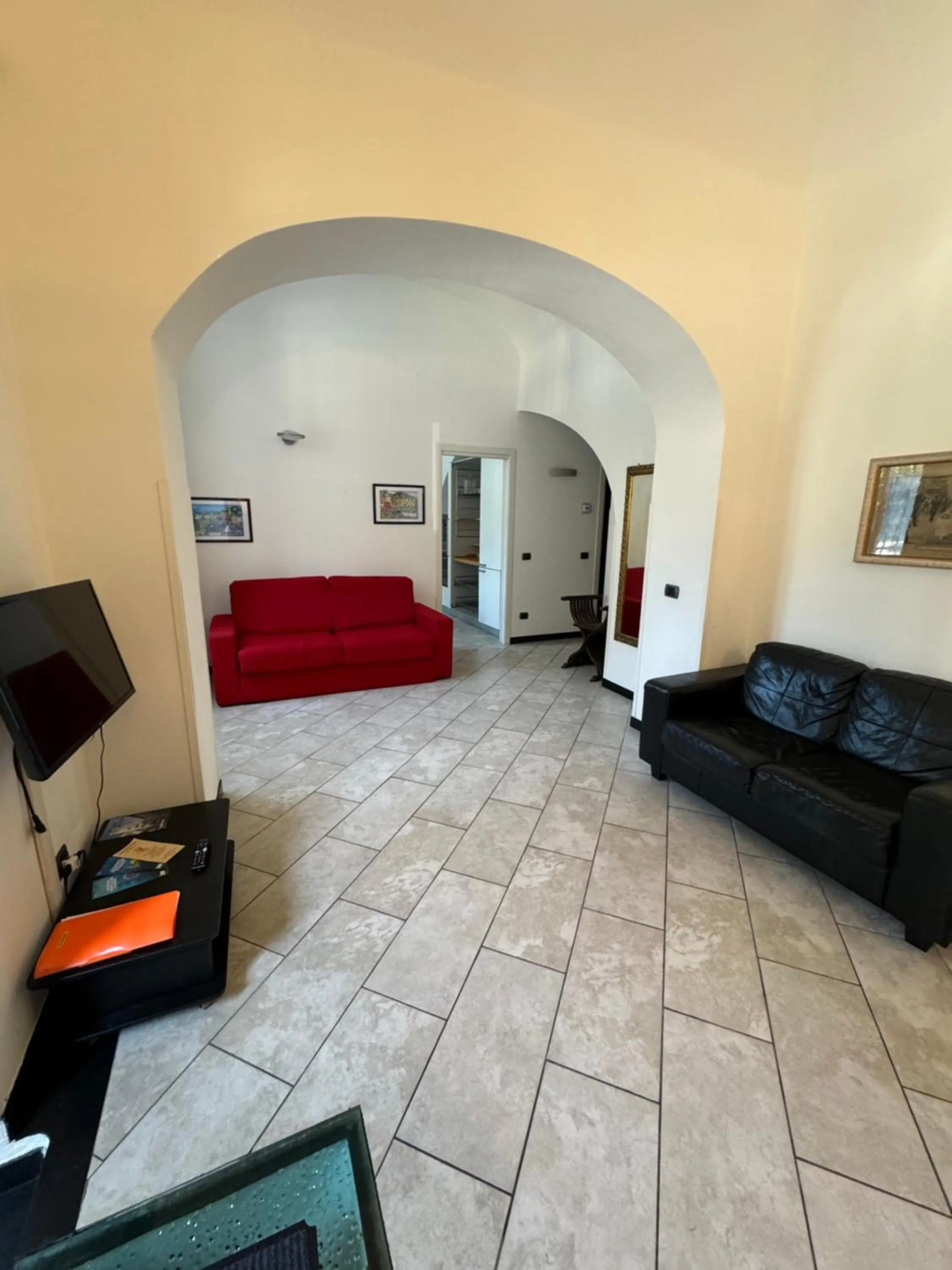 Communal lounge/ TV room in Appartamenti Michela