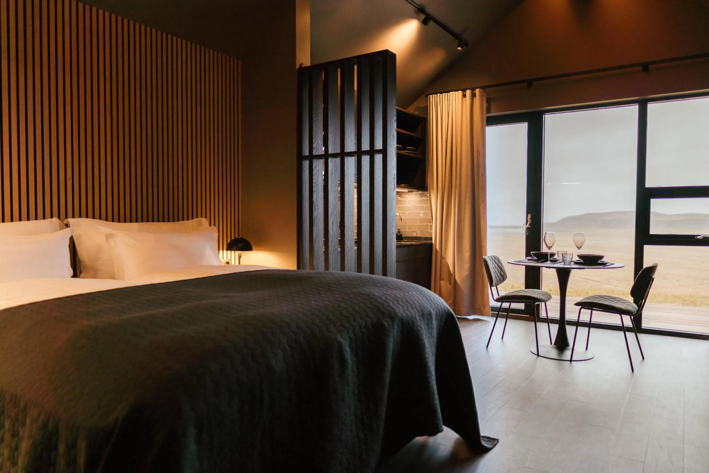 Bed in Black Beach Suites