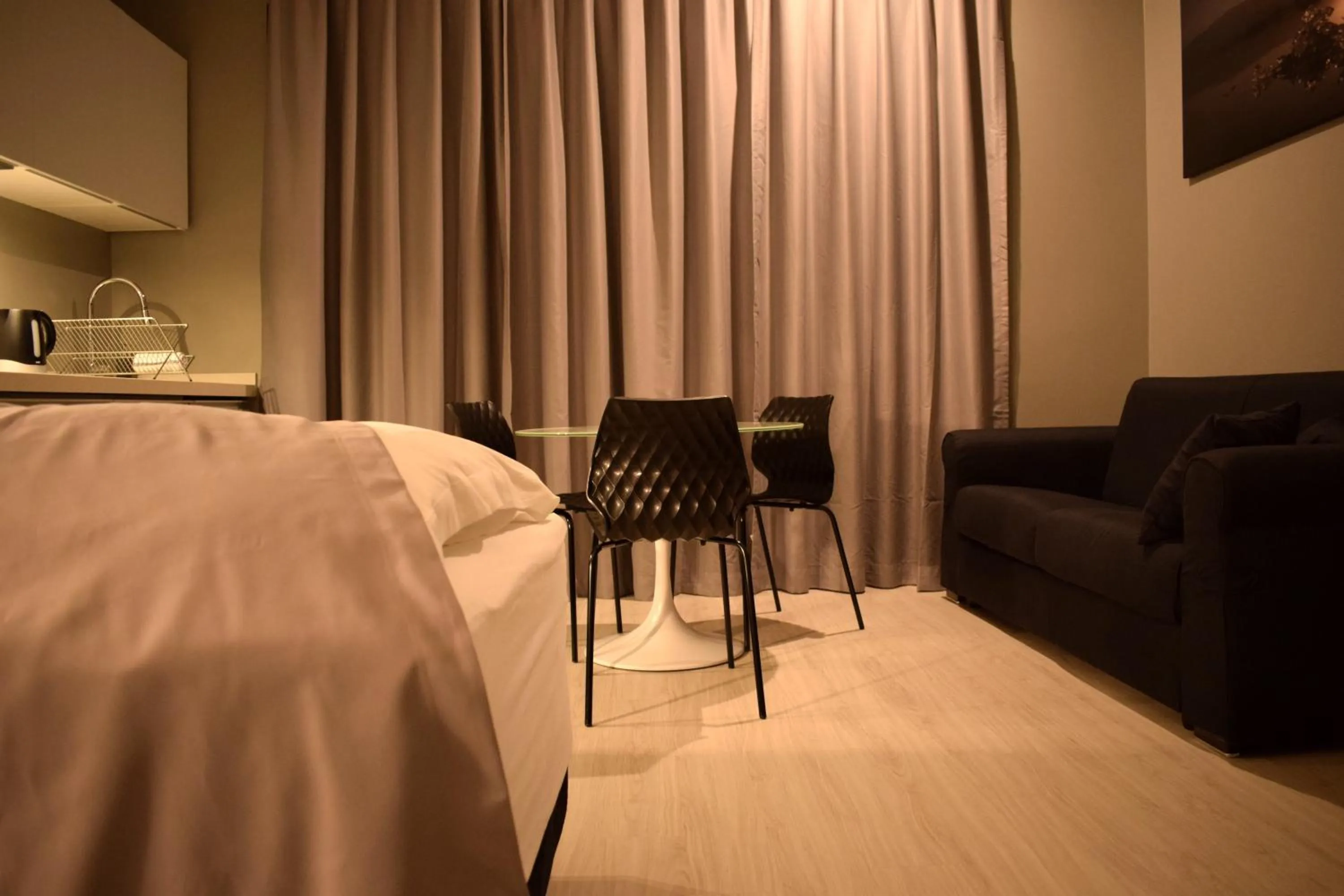 Bed in Black Beach Suites