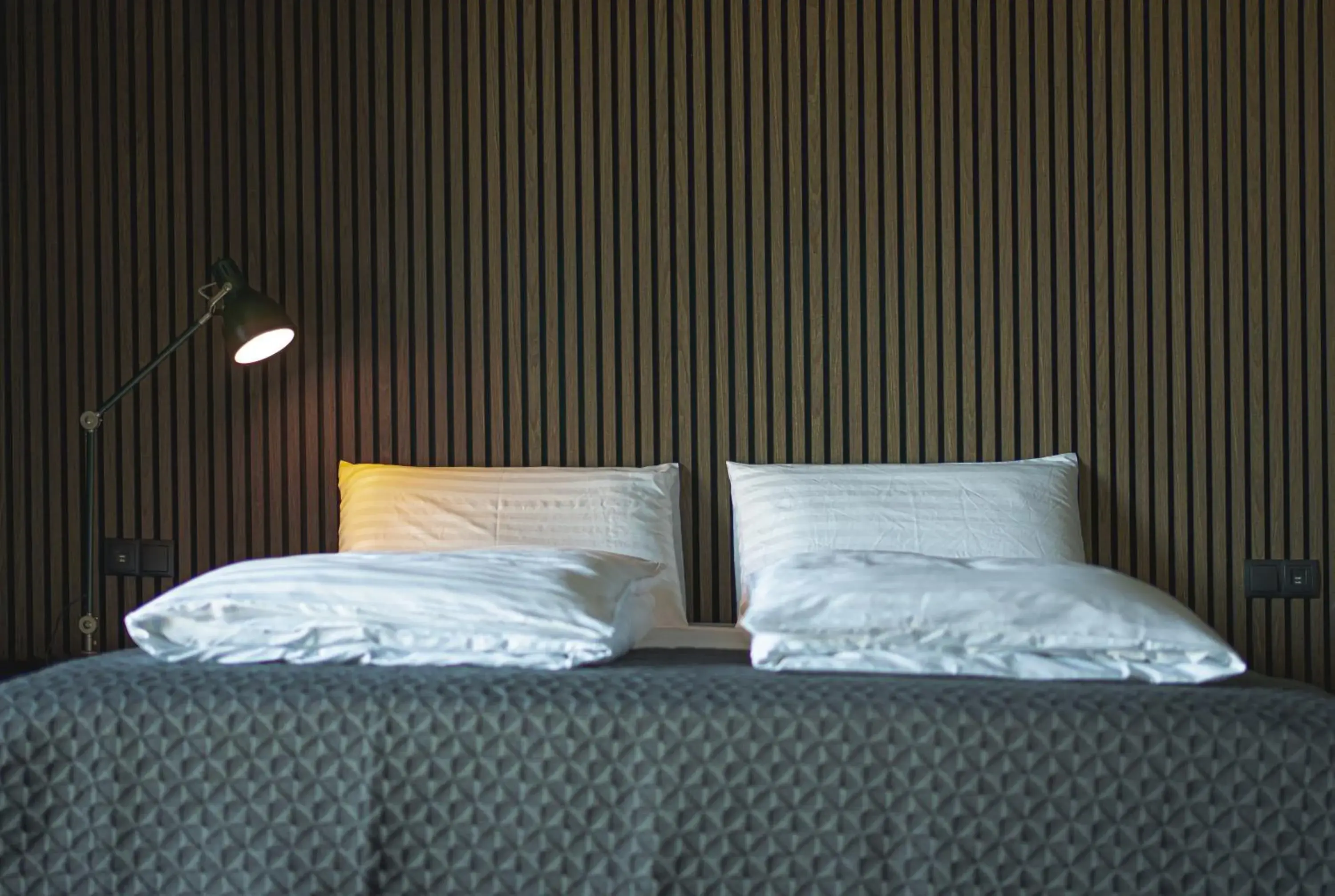 Bed in Black Beach Suites Bed in Black Beach Suites