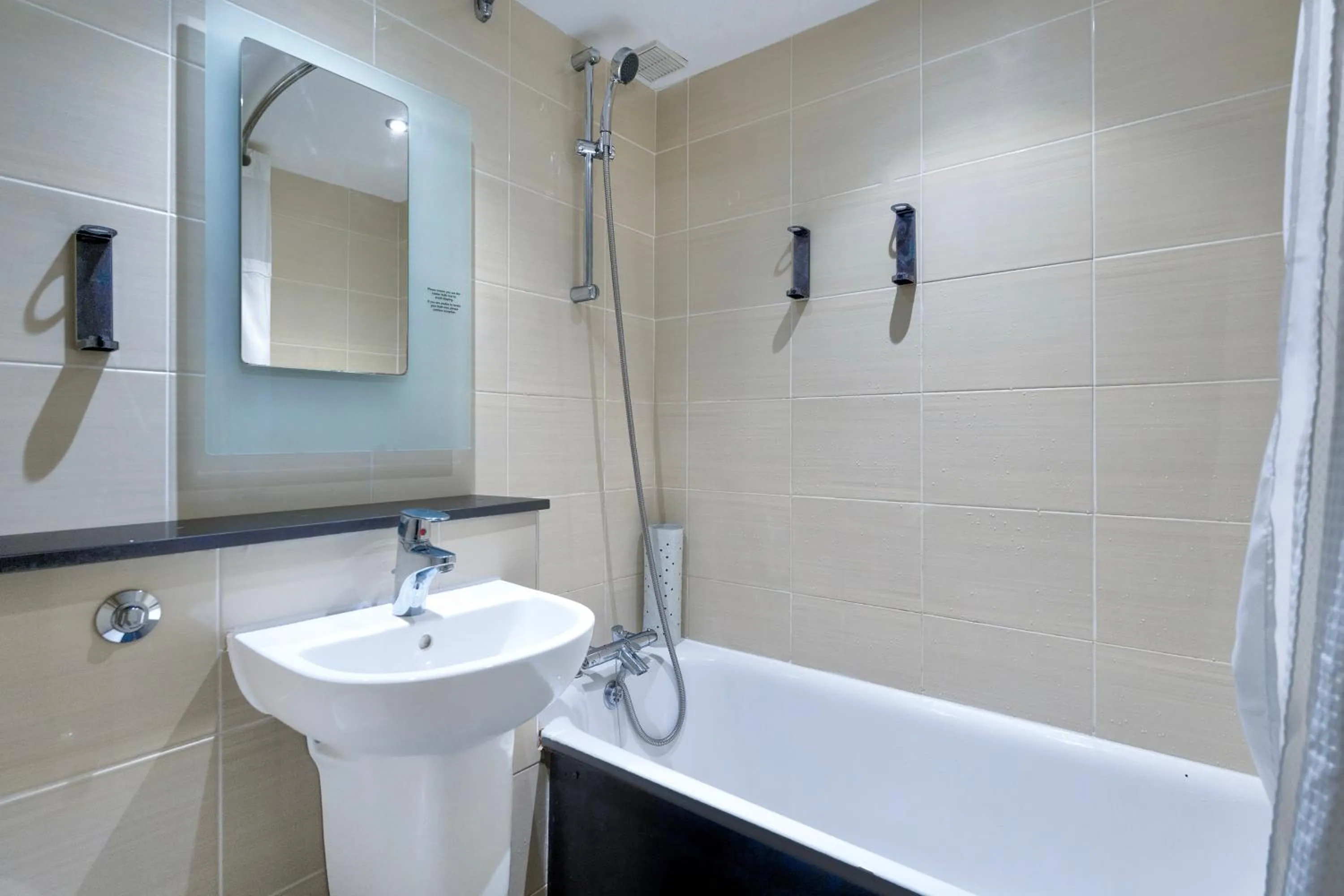 Bathroom in Manchester Airport Stanley Hotel by Belvilla