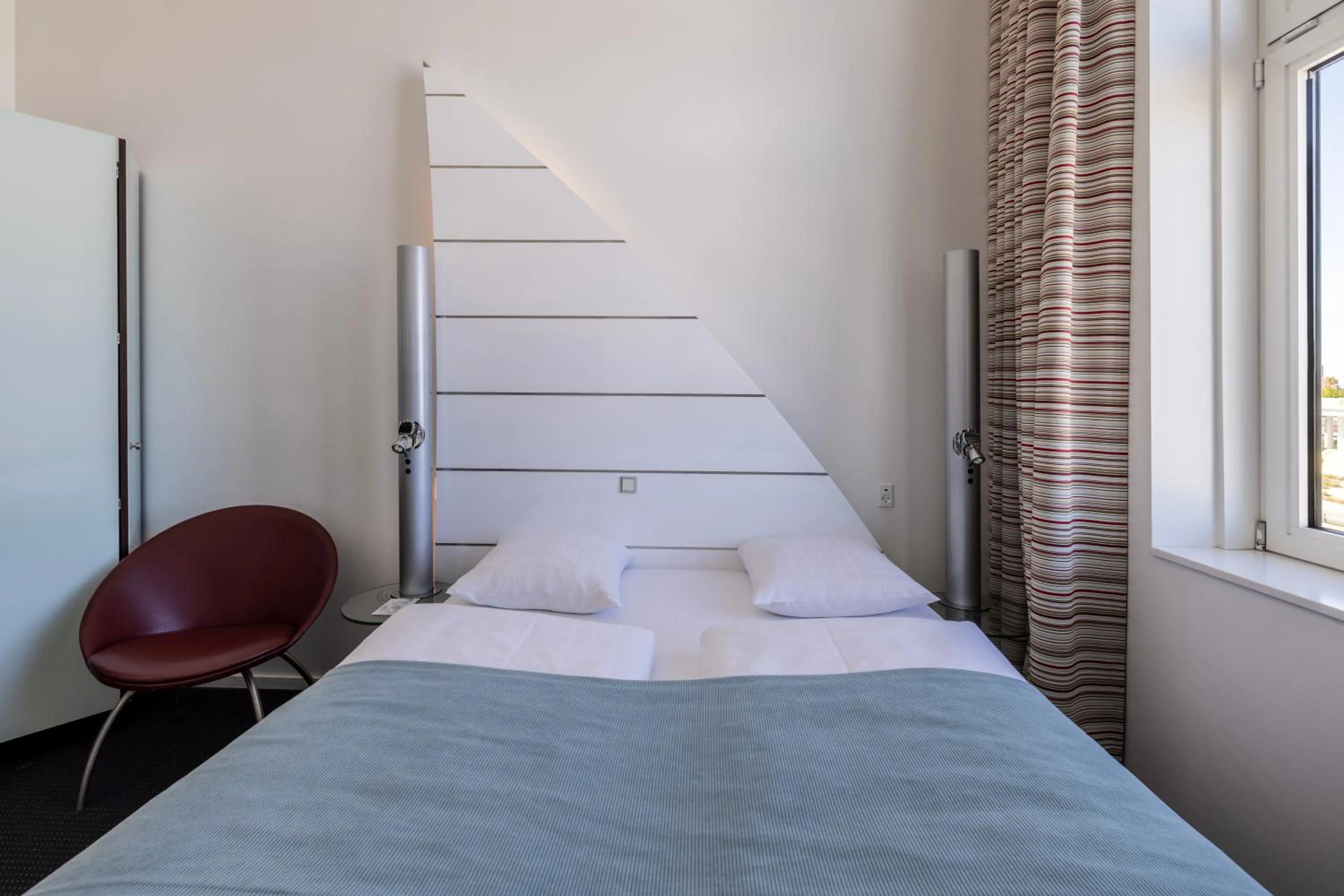 Bed in Copenhagen Island Hotel