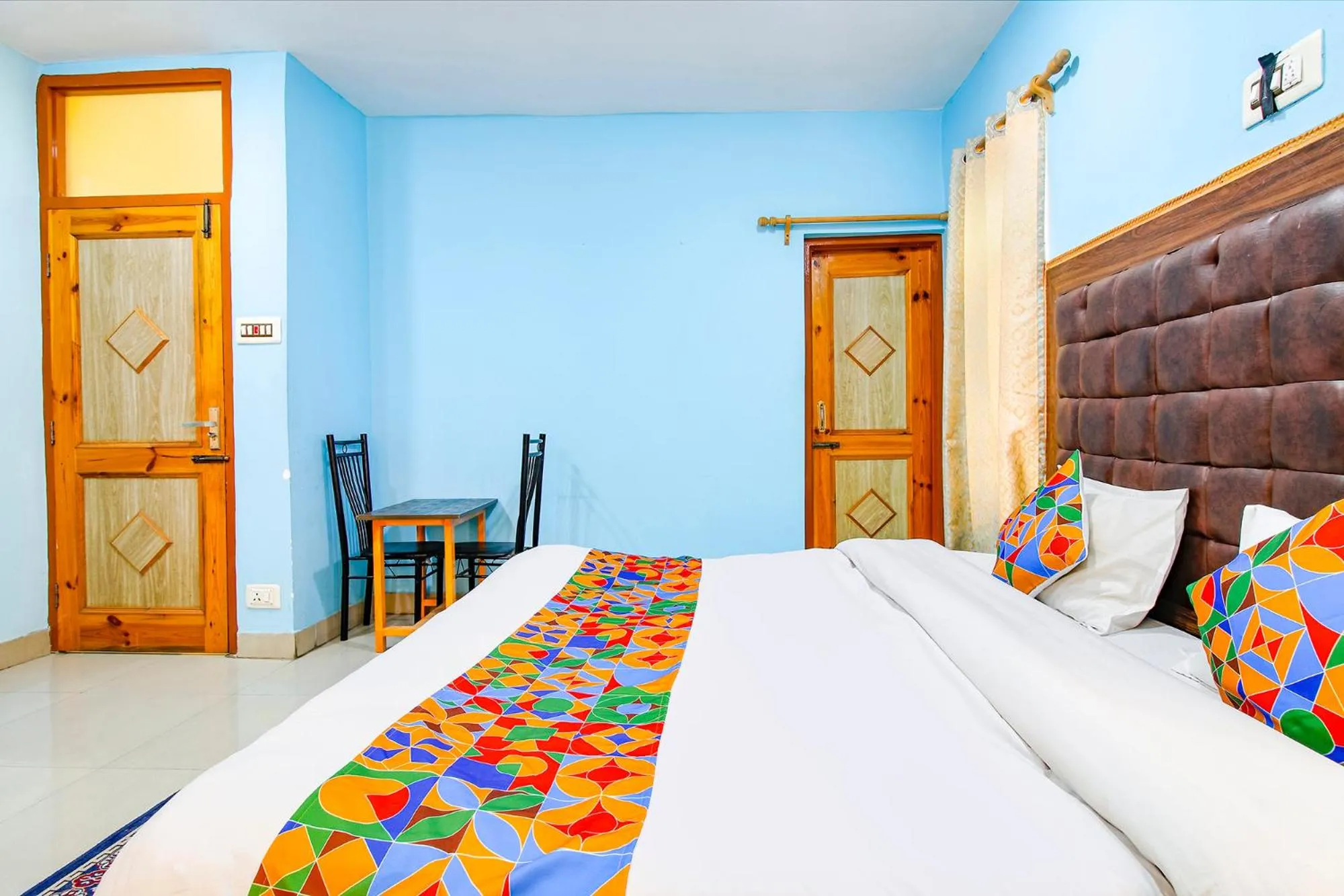 Bed in FabHotel Grand Comforts