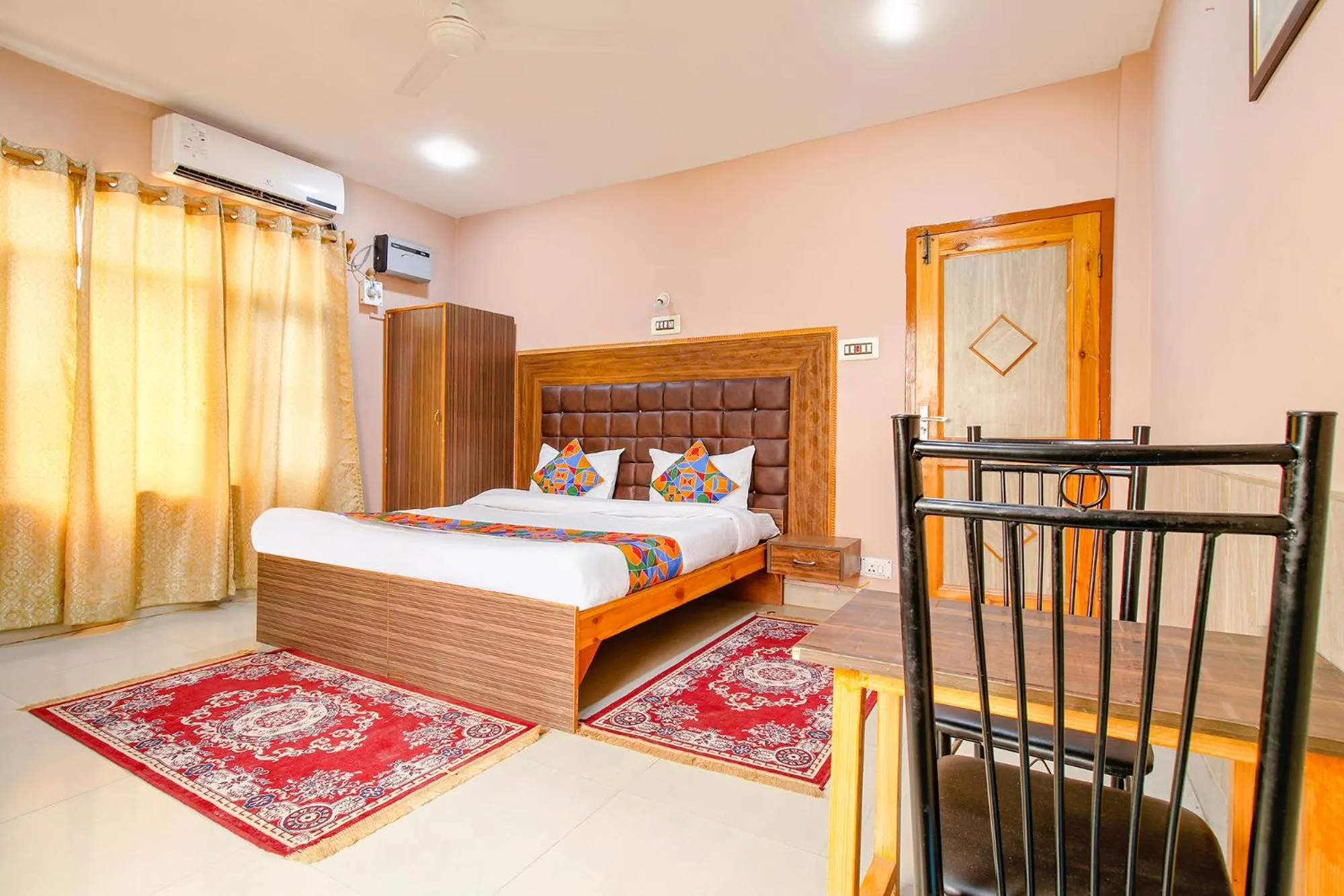 Bed in FabHotel Grand Comforts