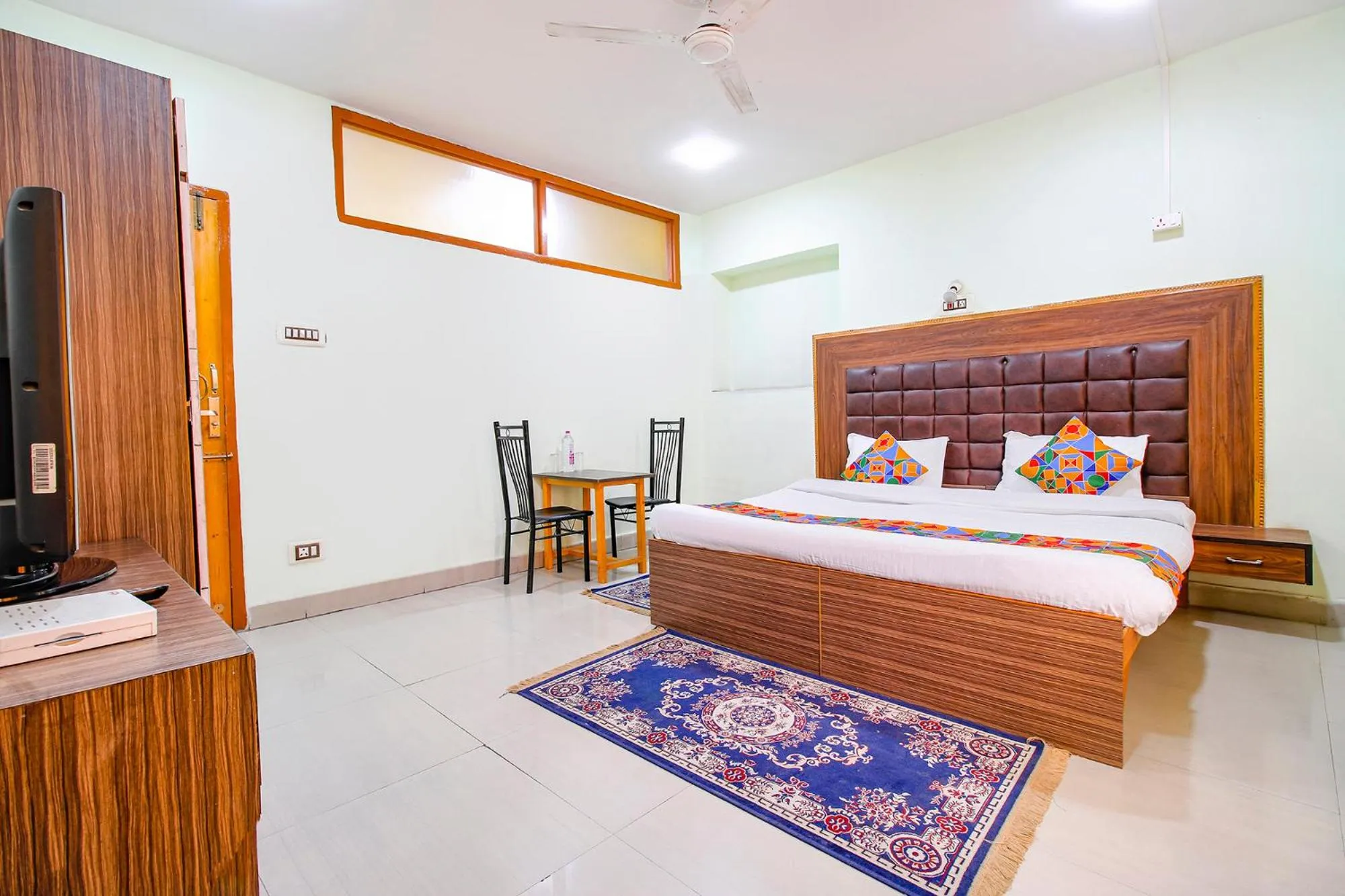 Bed in FabHotel Grand Comforts