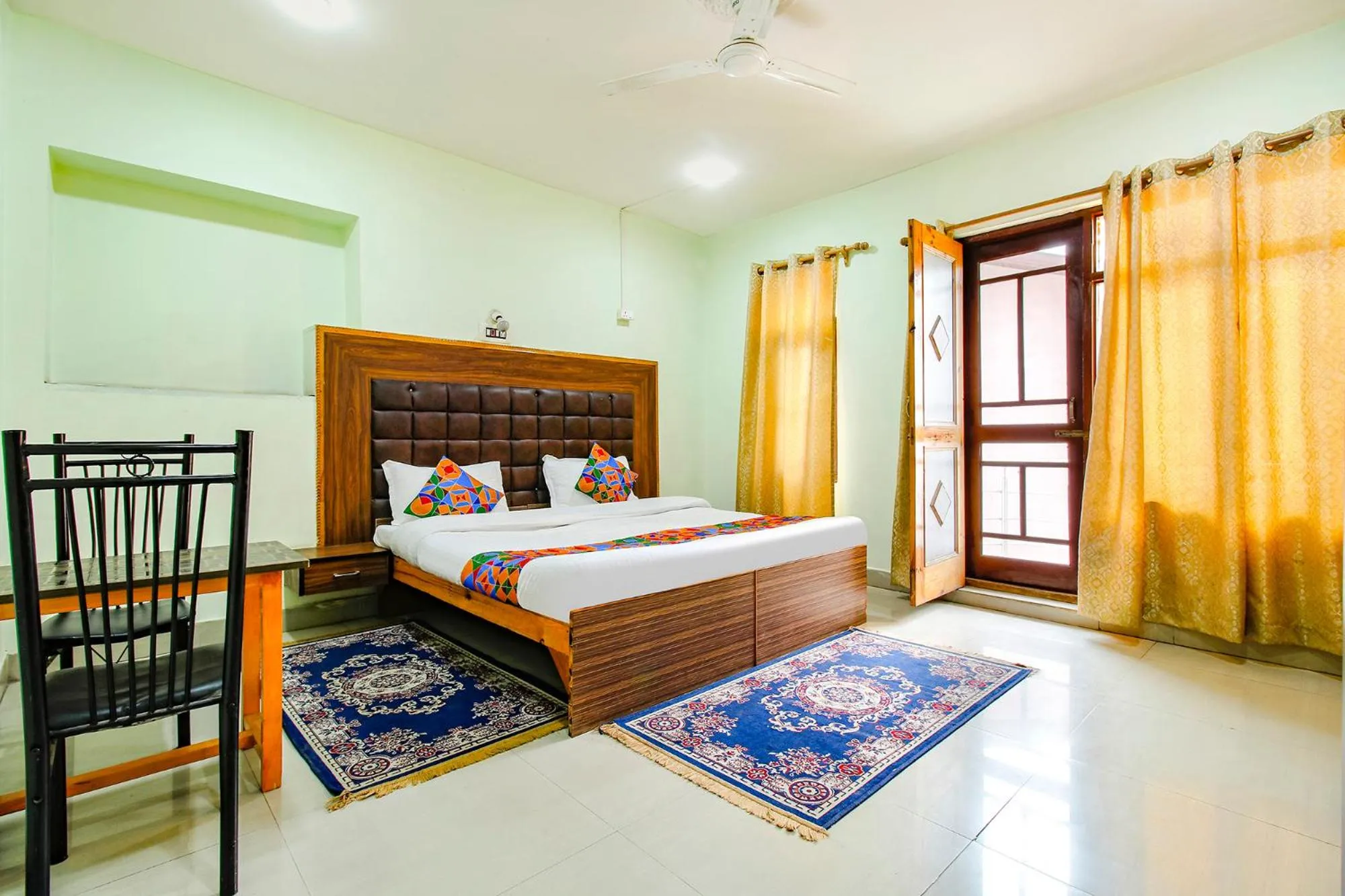 Bed in FabHotel Grand Comforts