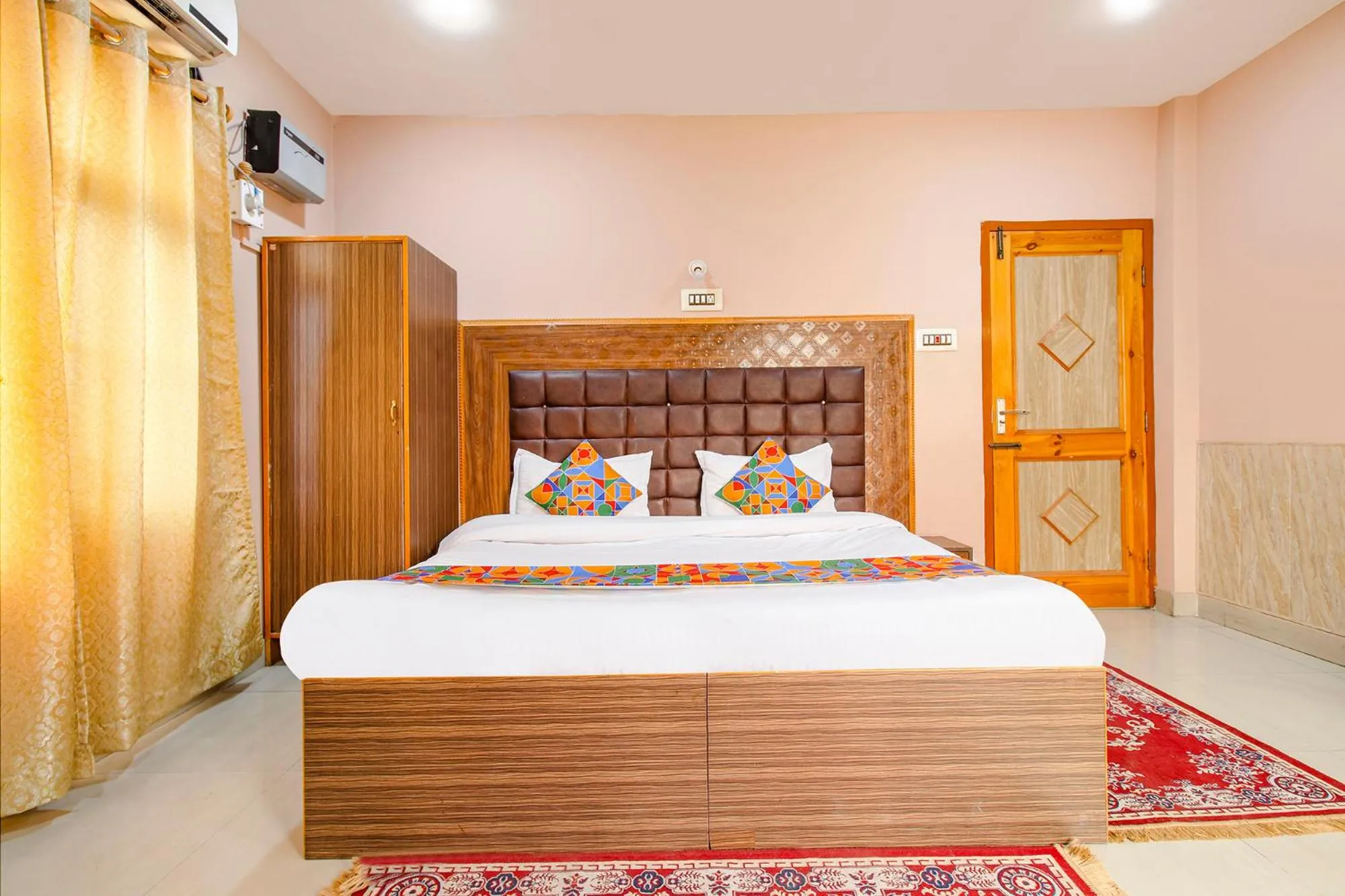 Bed in FabHotel Grand Comforts