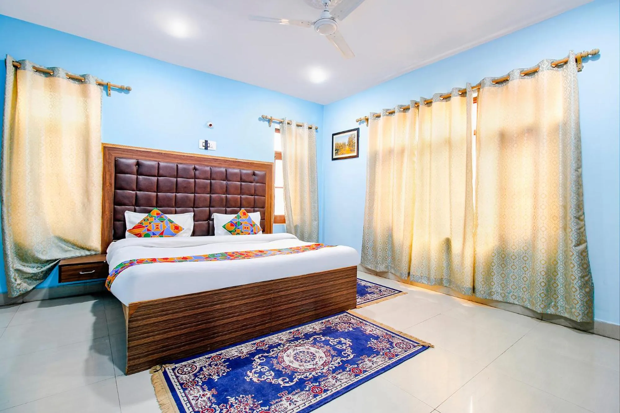 Bed in FabHotel Grand Comforts