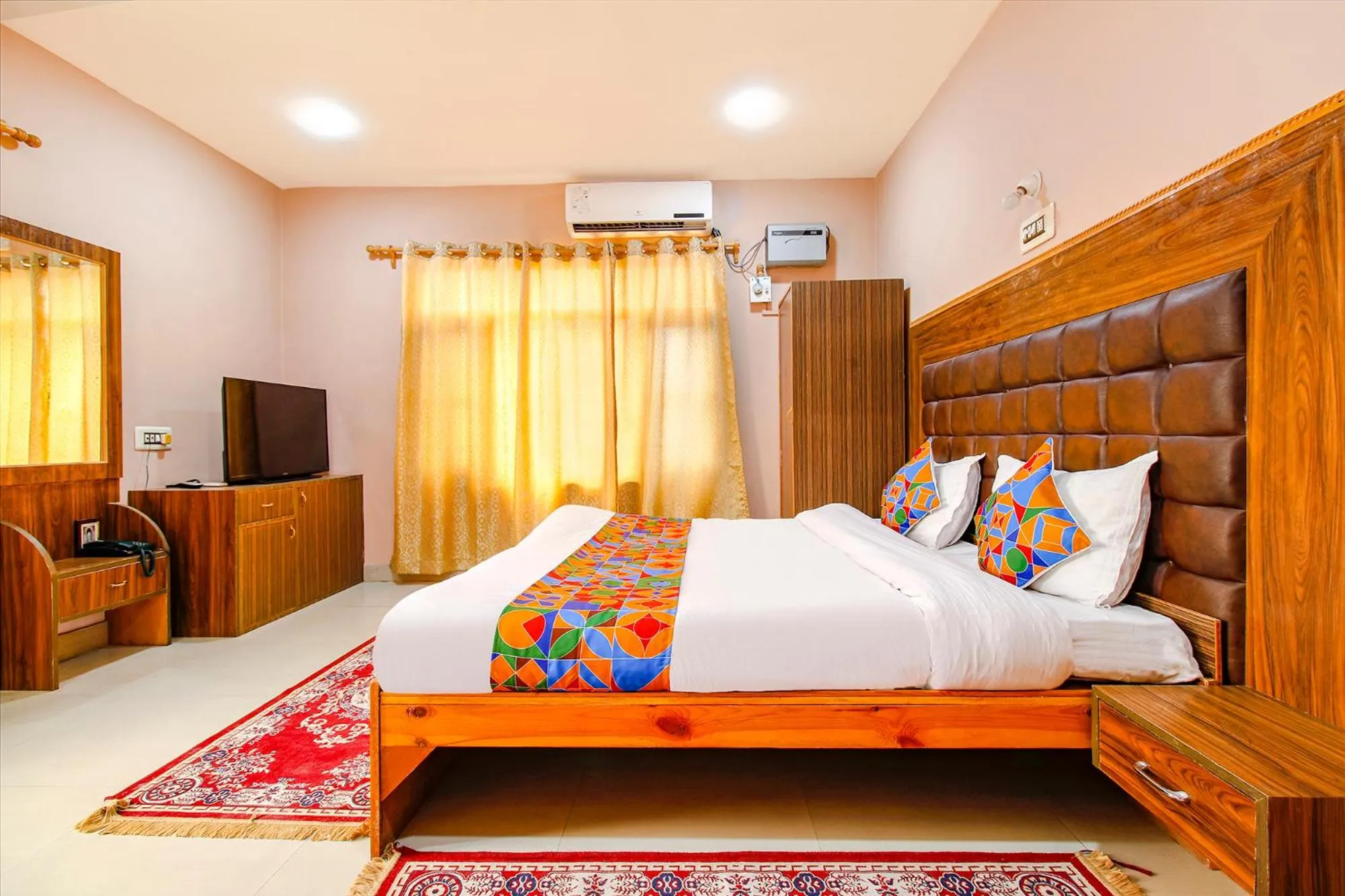 Bed in FabHotel Grand Comforts