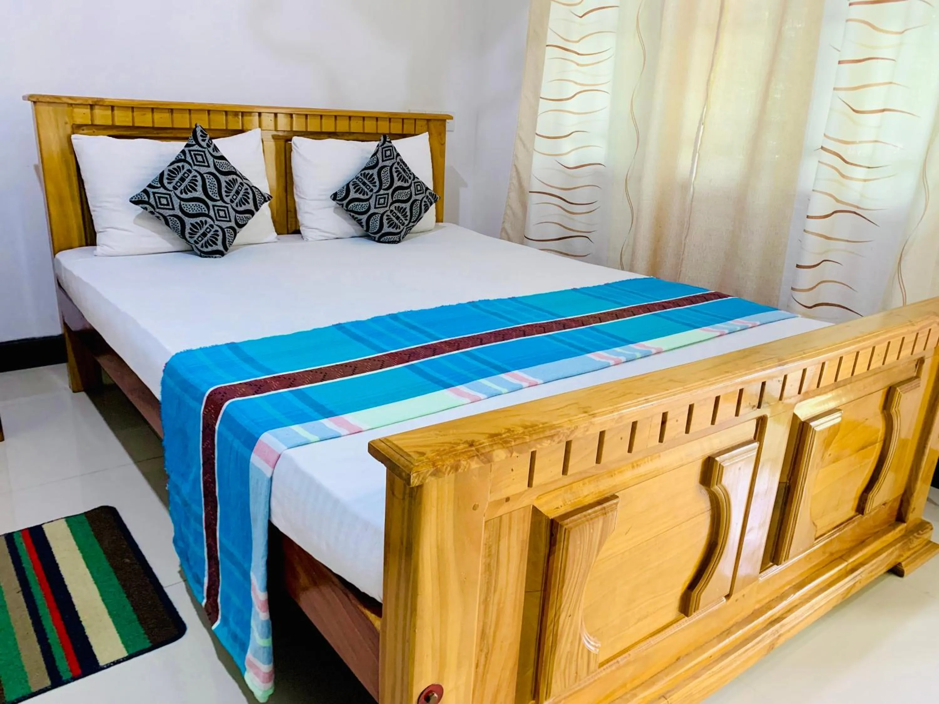 Bed in Rich Resort & Restaurant