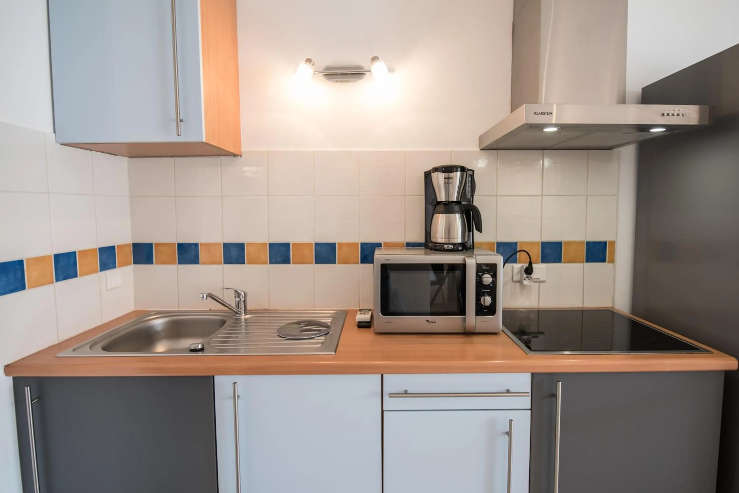 Kitchen or kitchenette in Les Alizés Résidence & Spa