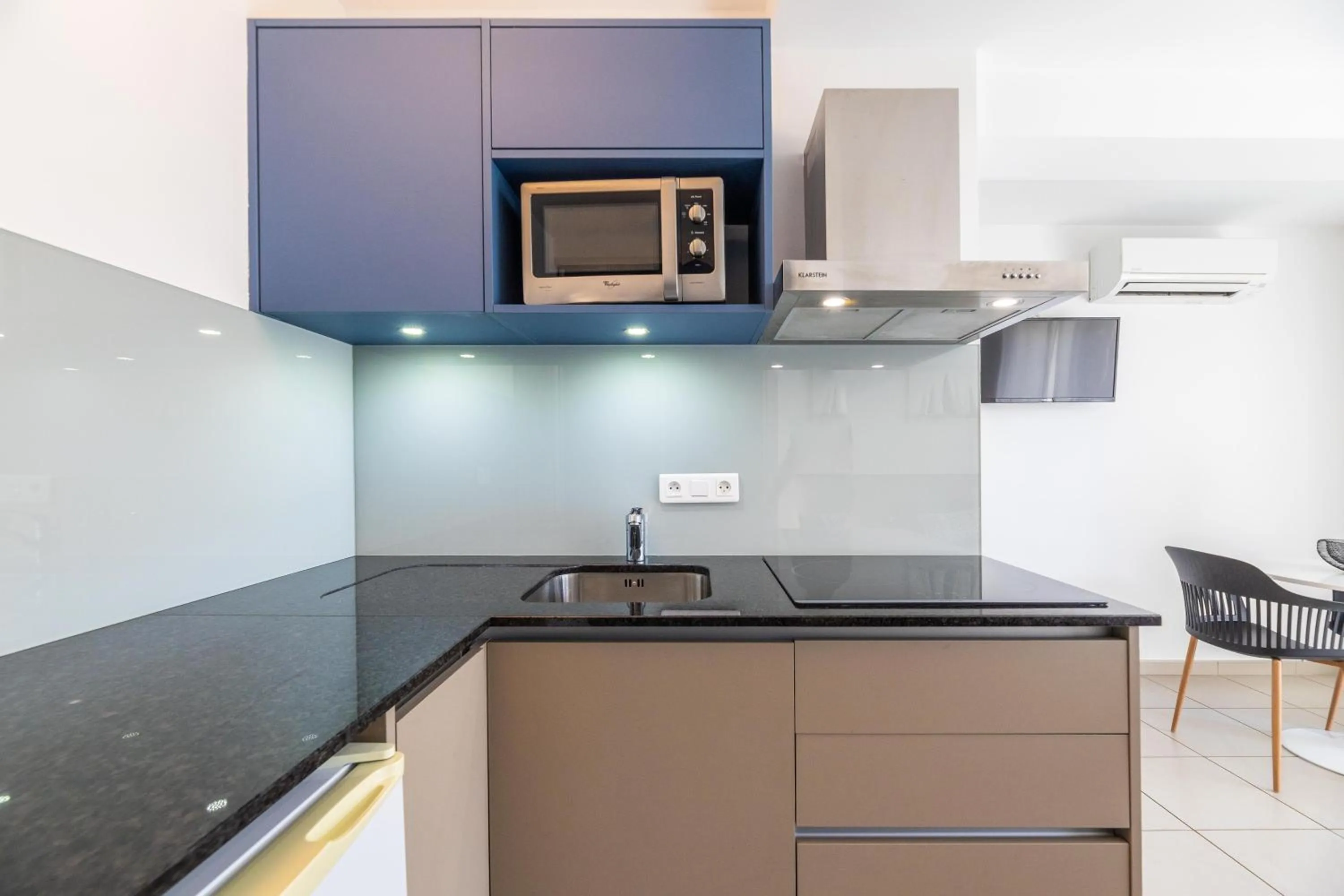 Kitchen or kitchenette in Les Alizés Résidence & Spa