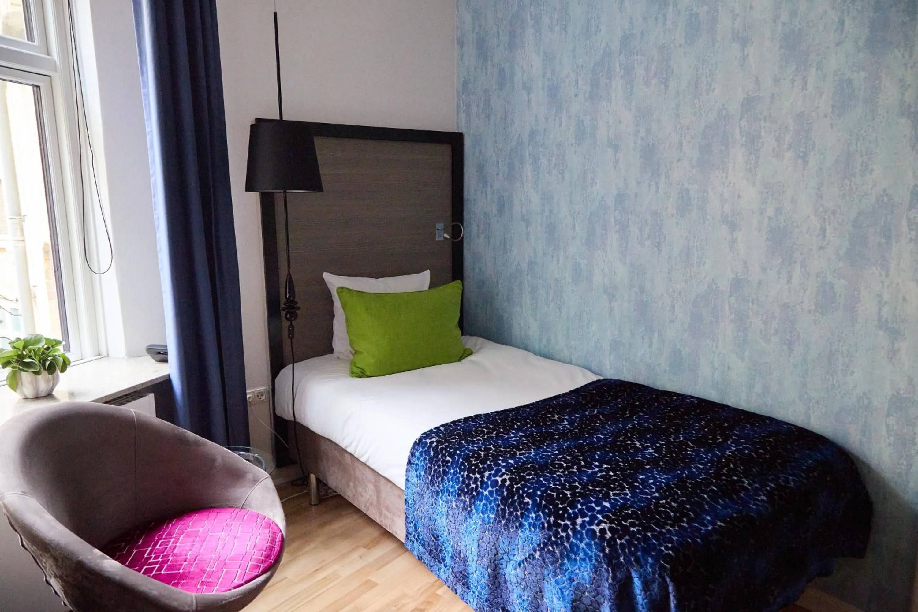 Bed in Andersen Boutique Hotel