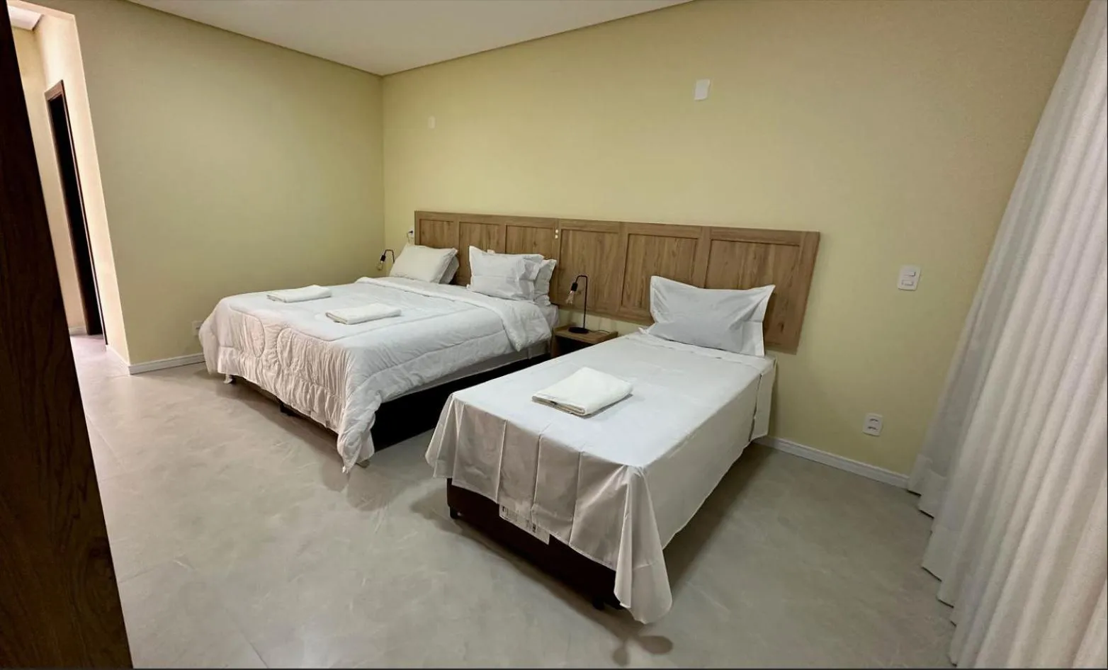 Bed in Pousada Casarão Gastehaus