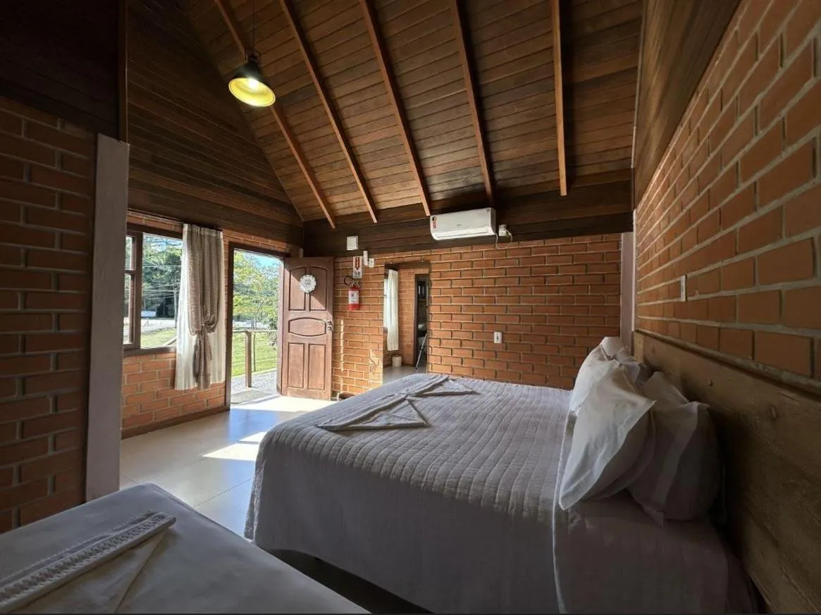 Bed in Pousada Casarão Gastehaus